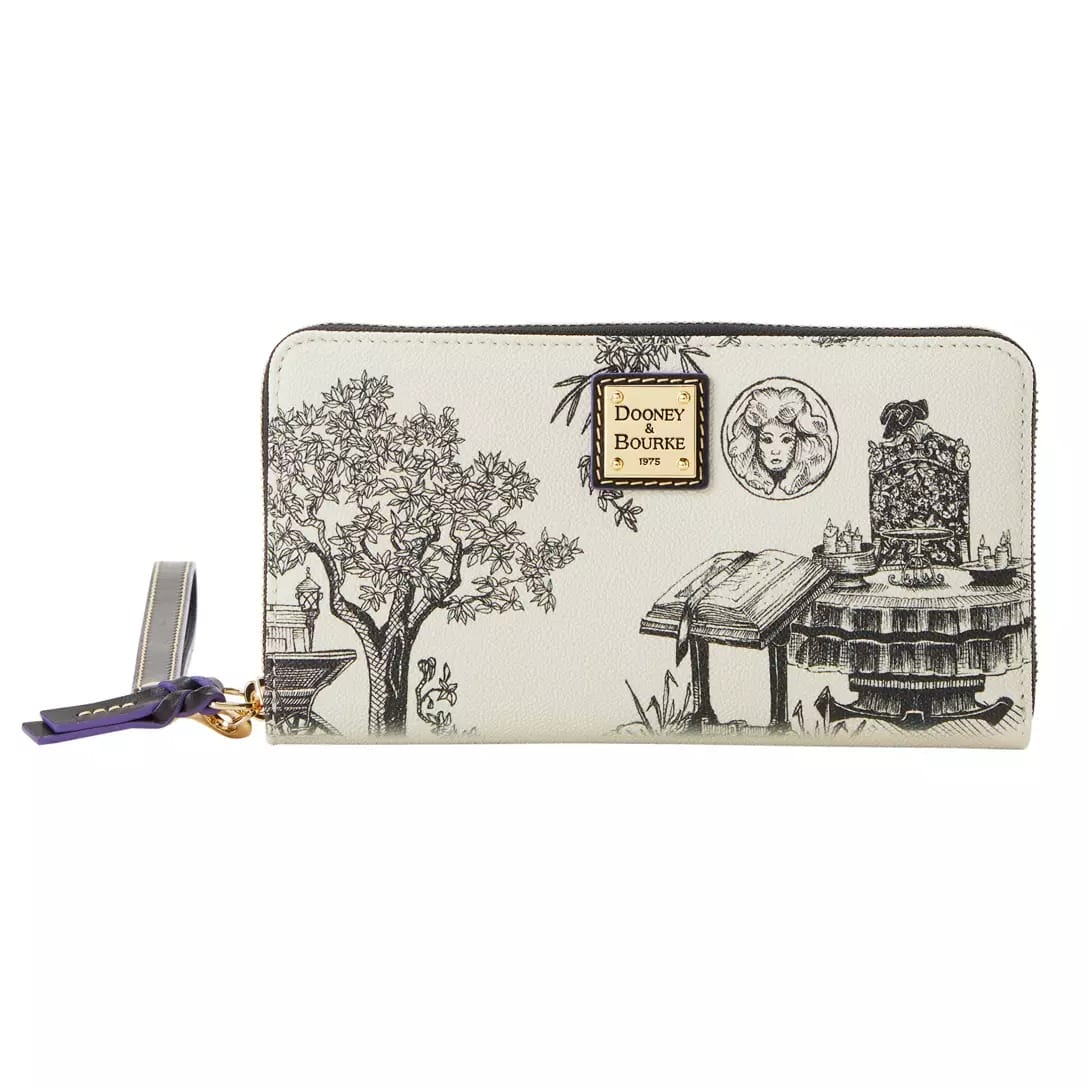 A cream Dooney & Bourke zip wallet from the Haunted Mansion Collection with black sketches and an Alice in Wonderland theme.