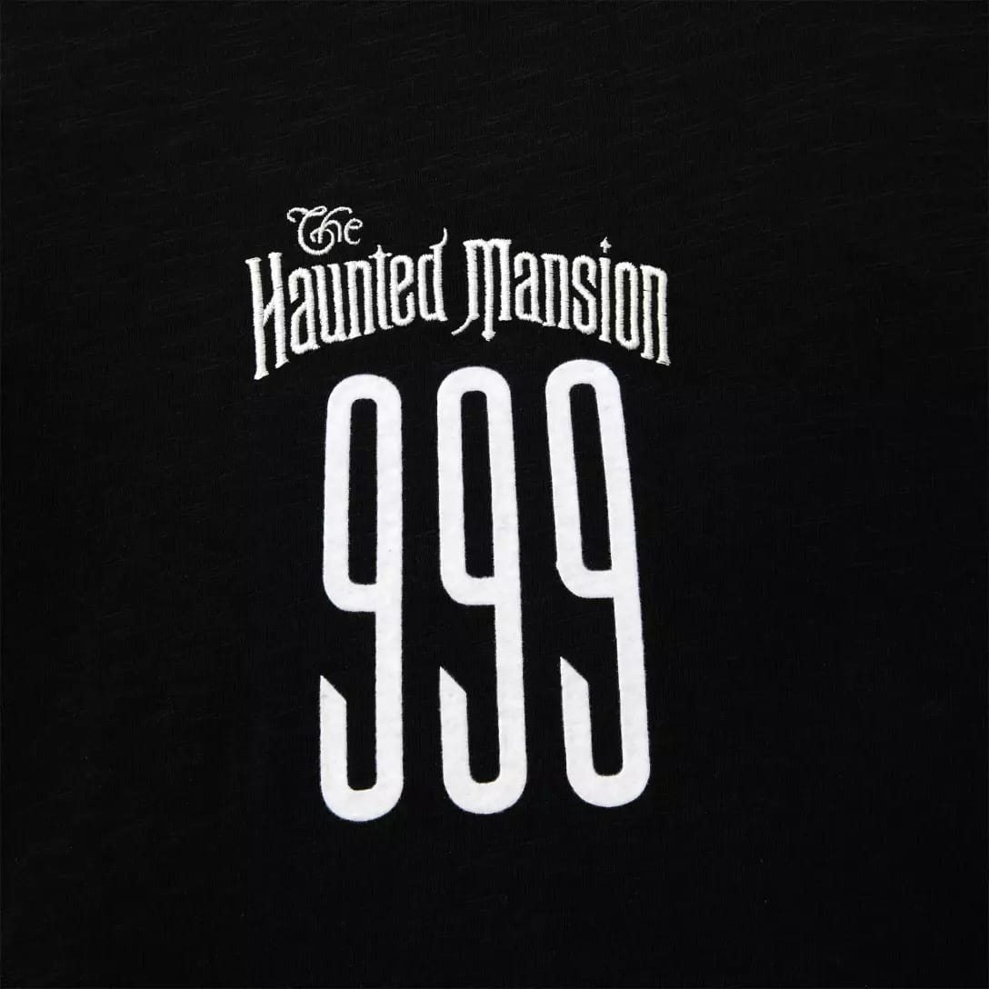 Black shirt from the Disney Store’s Haunted Mansion Collection with "The Haunted Mansion" and bold white "999" print.