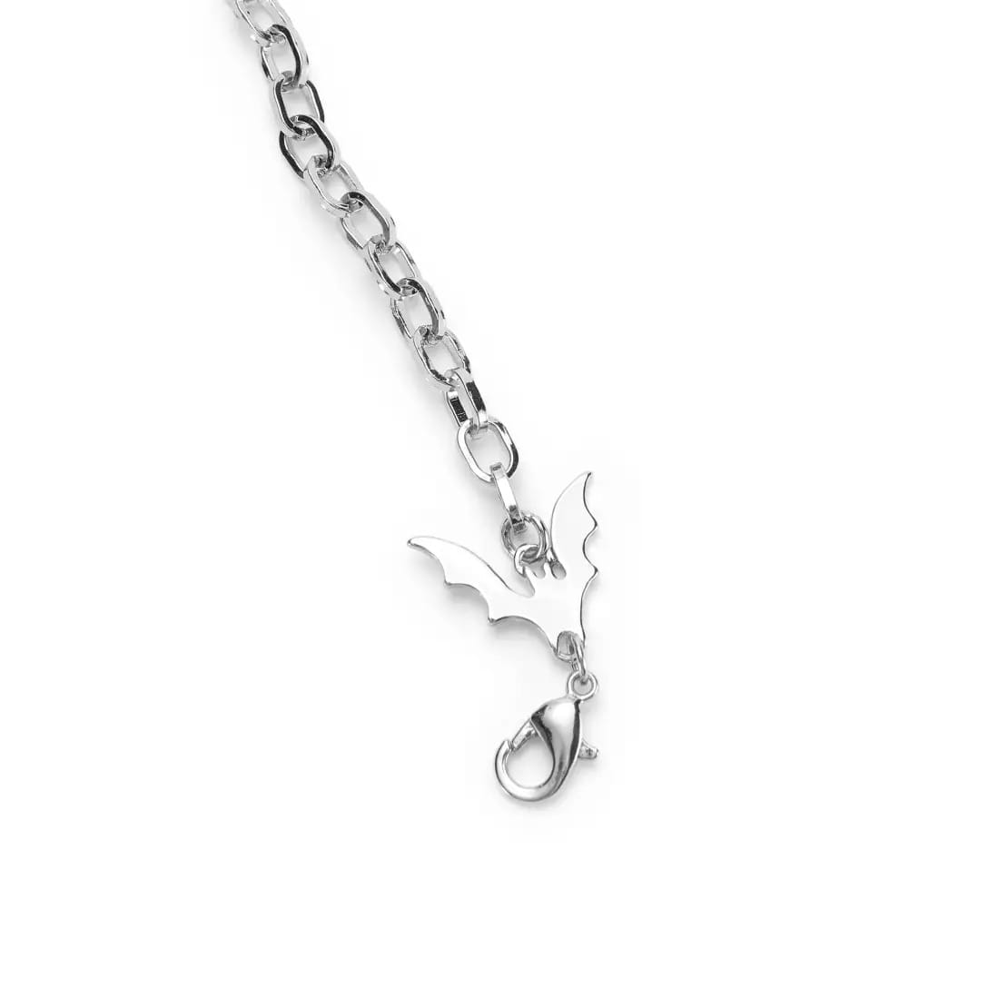 Silver chain necklace with a bat-shaped charm, inspired by Disney Store’s Haunted Mansion, on a white background.