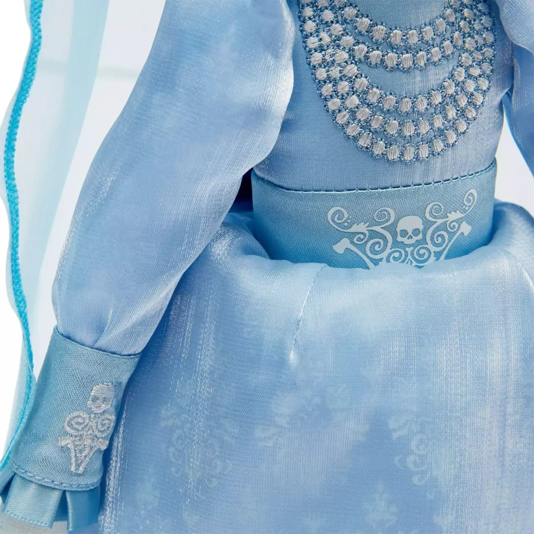 Close-up of a Disney Store doll in a shiny blue dress with detailed embroidery, perfect for any collection.