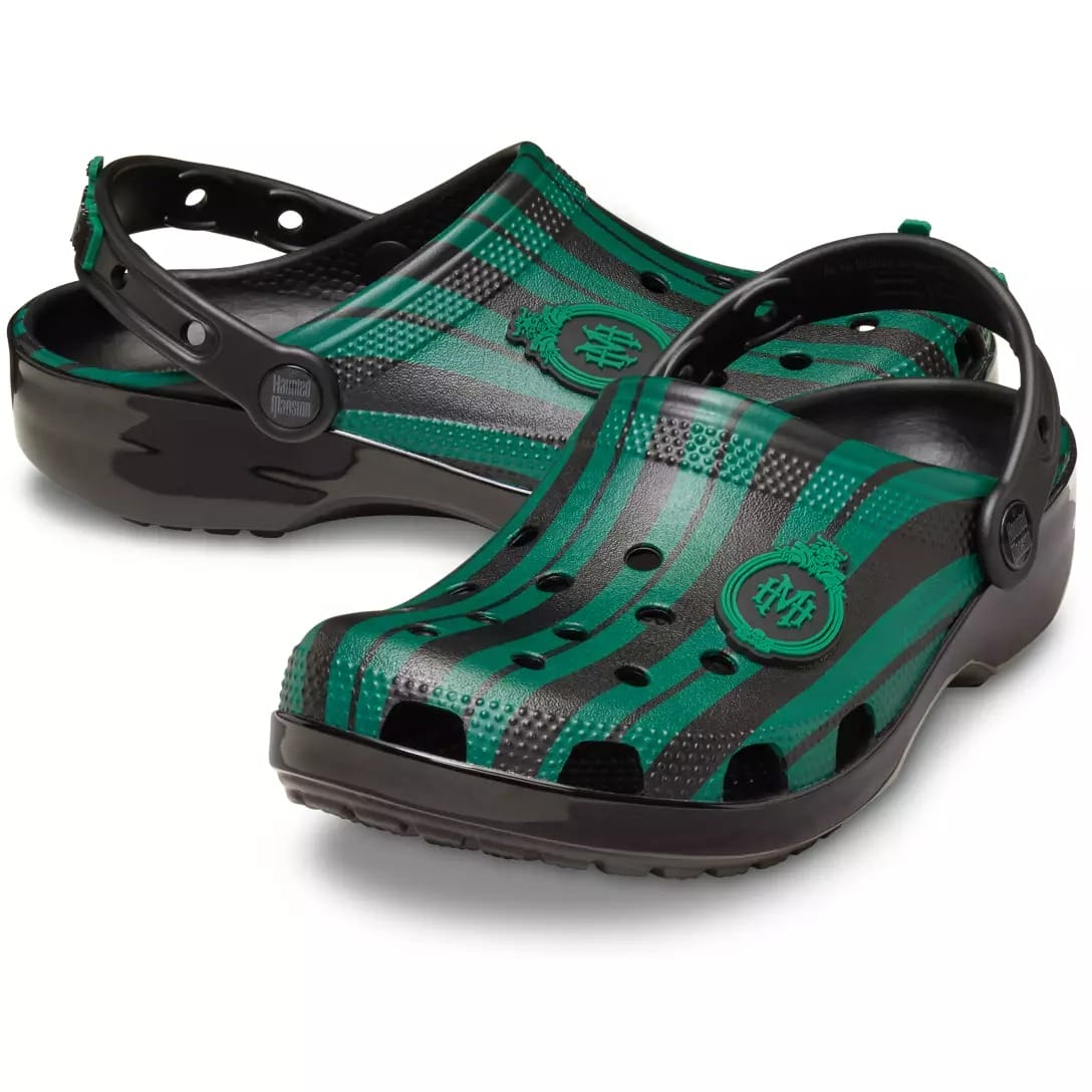 Green and black striped Crocs clogs with ventilation holes from the Haunted Mansion Collection.