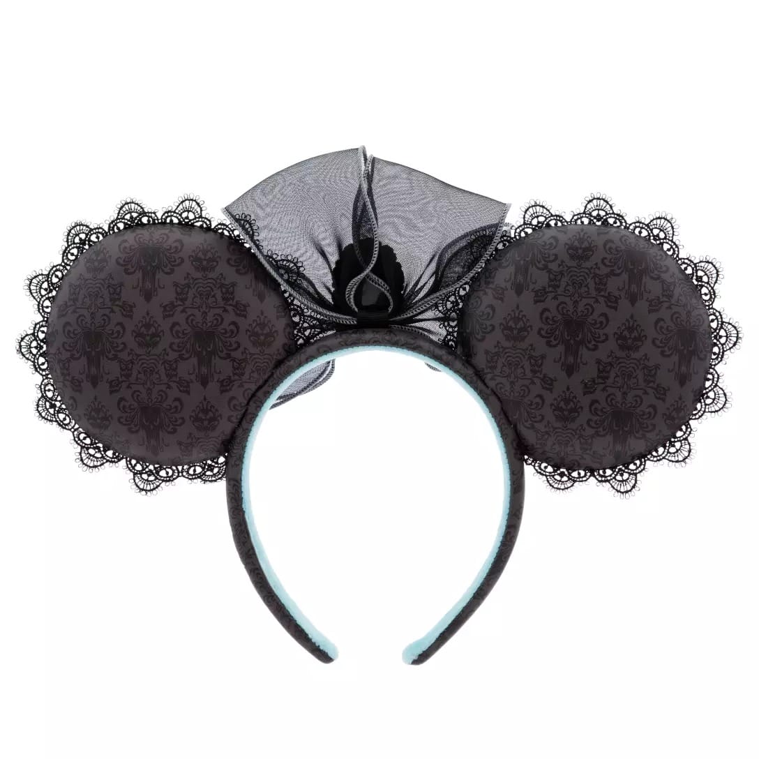 Black lace Minnie Mouse ears headband with a large bow, part of the Haunted Mansion Collection at Disney Store.