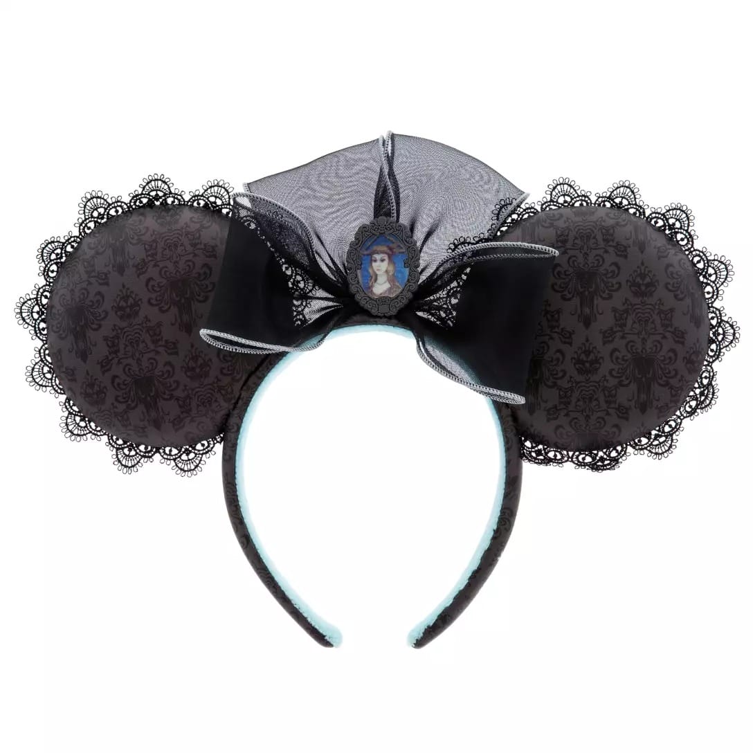 Black lace Minnie Mouse ears headband from the Haunted Mansion Collection with a sheer bow and cameo portrait.