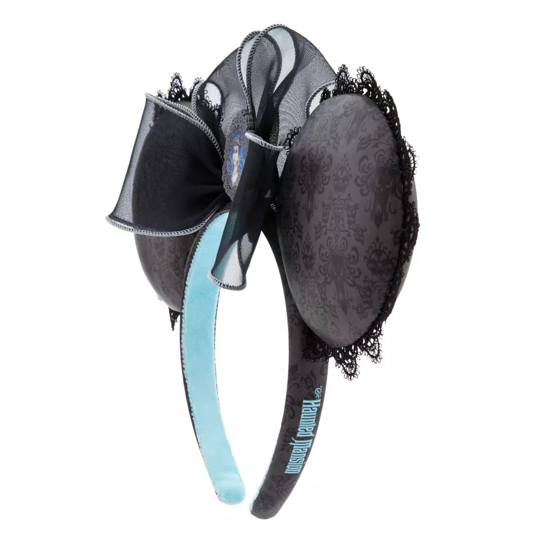 Black and gray mouse ear headband from the Haunted Mansion Collection, featuring a sheer bow and blue Haunted Mansion text.