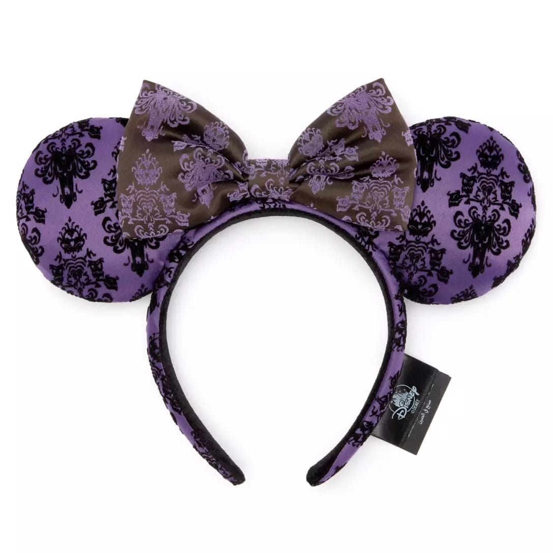 Purple Minnie Mouse ears headband with a bow and black damask from the Haunted Mansion Collection at Disney Store.
