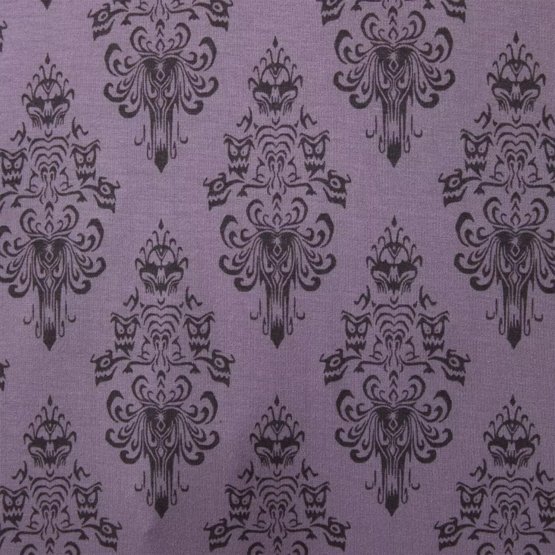 Purple fabric with a vintage black damask pattern, inspired by the Haunted Mansion Collection at Disney Store.