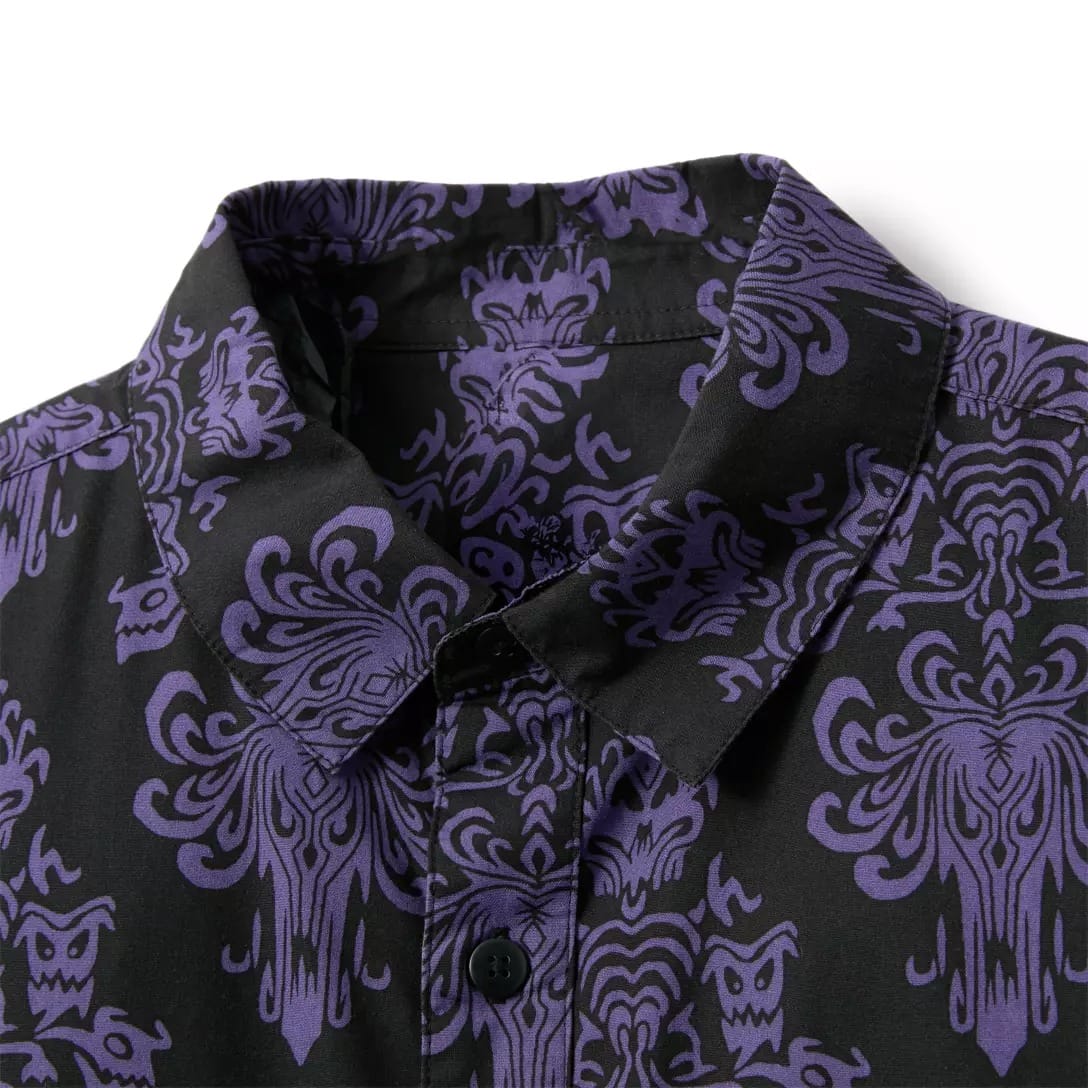 Close-up of a black button-up shirt from the Haunted Mansion Collection with a purple gothic-style patterned design.