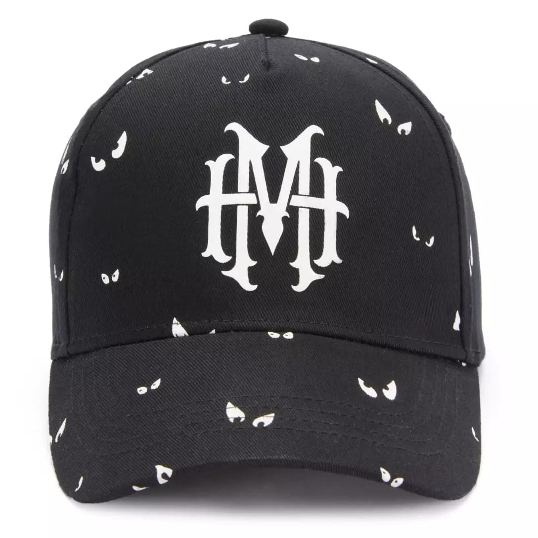 Black baseball cap with a white gothic "MH" logo and eye designs, part of the Haunted Mansion Collection.