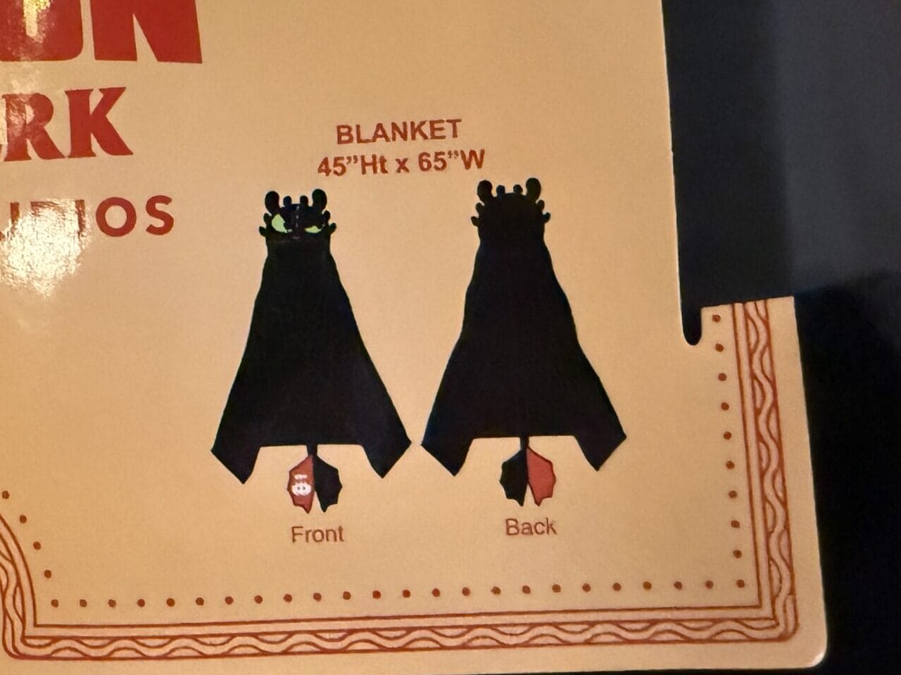 A label for a "How to Train Your Dragon: Isle of Berk" blanket from Hiccup's Work Shop, front and back views shown.