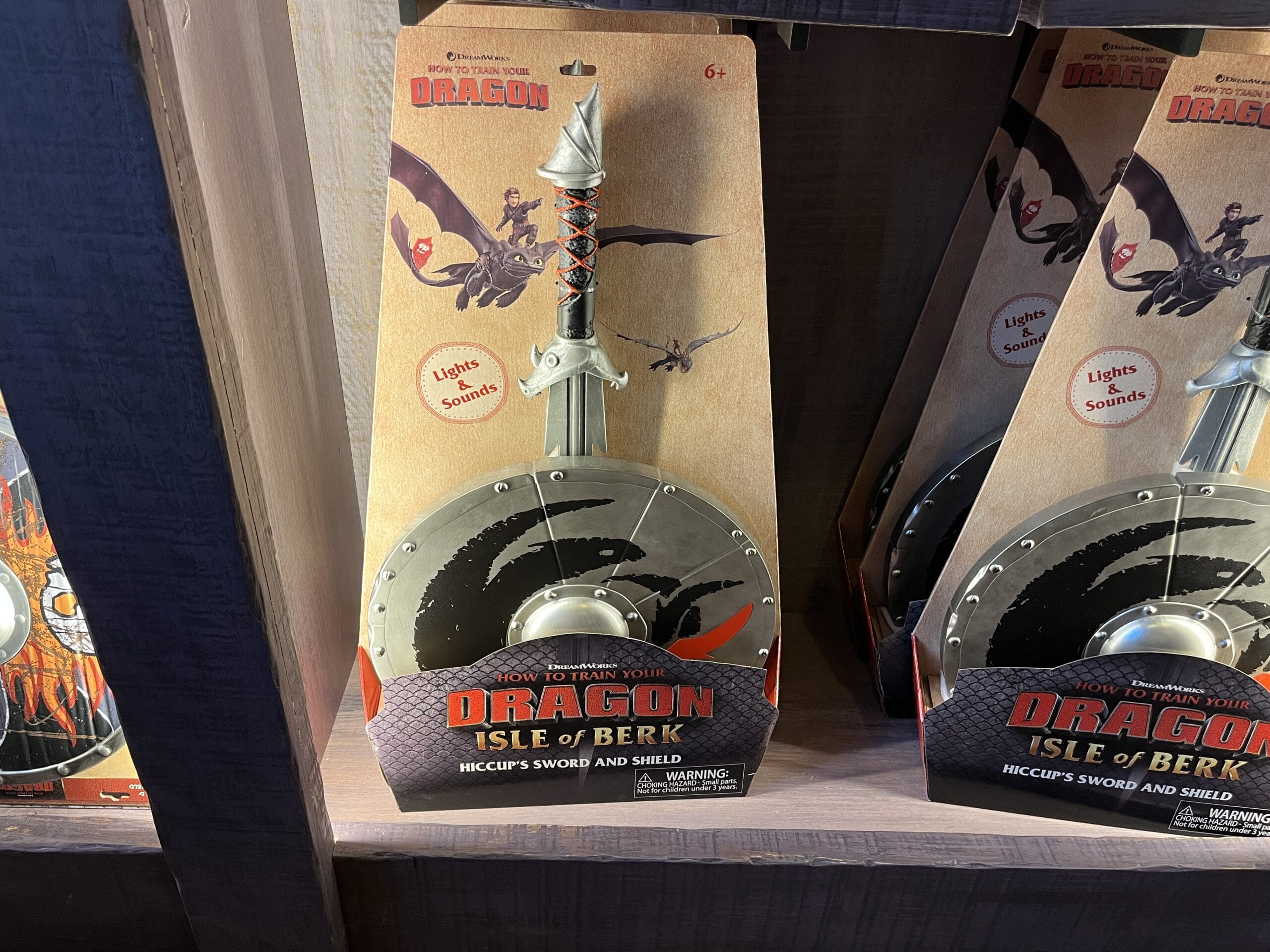 Hiccup's Work Shop sword and shield toy set from "How to Train Your Dragon: Isle of Berk" on display.