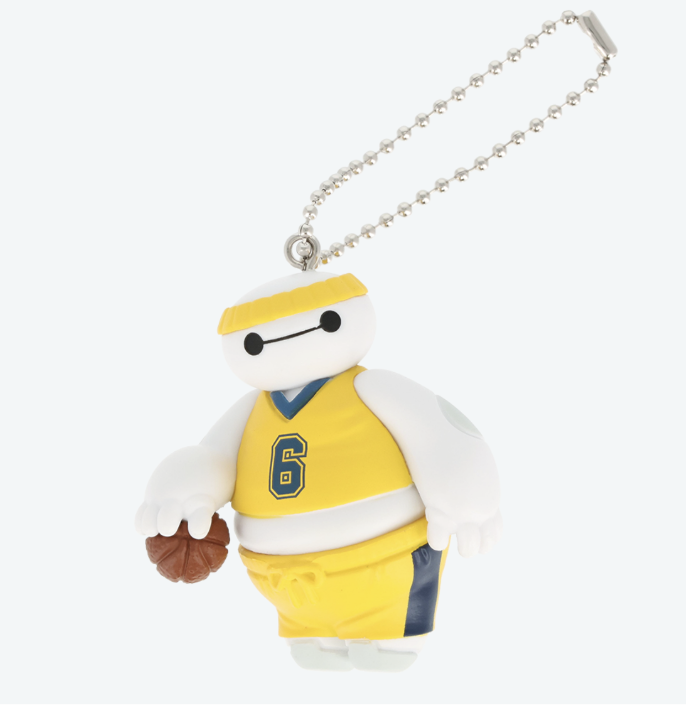 Baymax keychain from Capsule Toys featuring a white robot in a yellow basketball uniform at Tokyo Disney Resort.