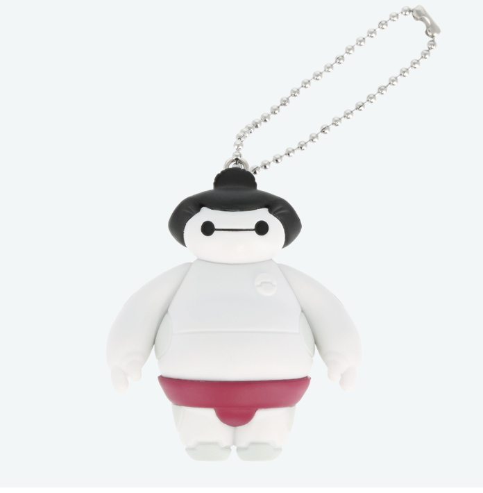 Keychain of a white cartoon figure dressed as a sumo wrestler with a topknot, like Baymax capsule toys.