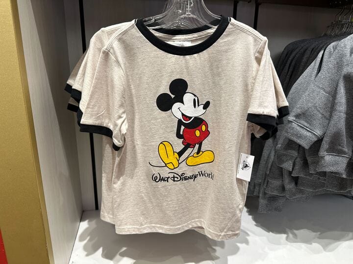 Beige T-shirt with Mickey Mouse graphic and "Walt Disney World" text—classic new apparel for Disney fans.