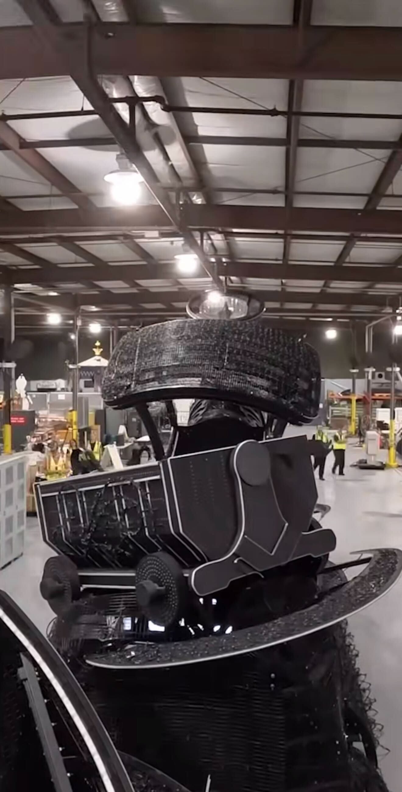 A black wire mesh vintage car sculpture echoes behind-the-scenes magic, like the Disney Starlight Parade.