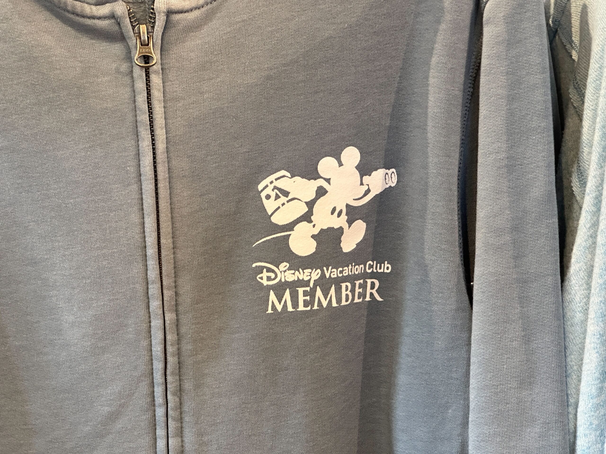 Gray zip-up jacket with Disney Vacation Club Member logo—perfect for resort stays or pairing with Old Key West T-Shirt.