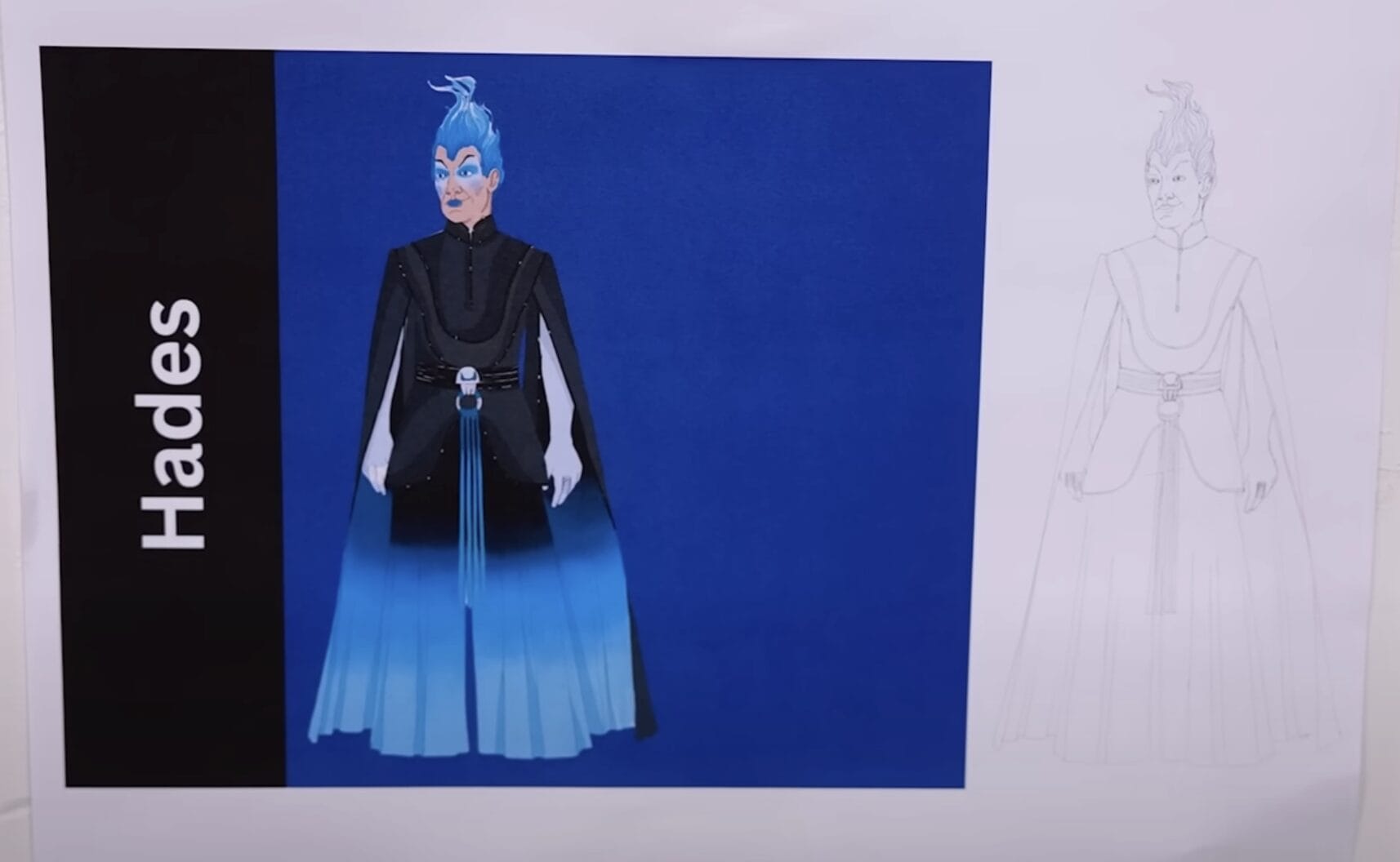 Concept art of Hades from the Disney Cruise Line Hercules stage show, in a black and blue robe on a white and blue background.