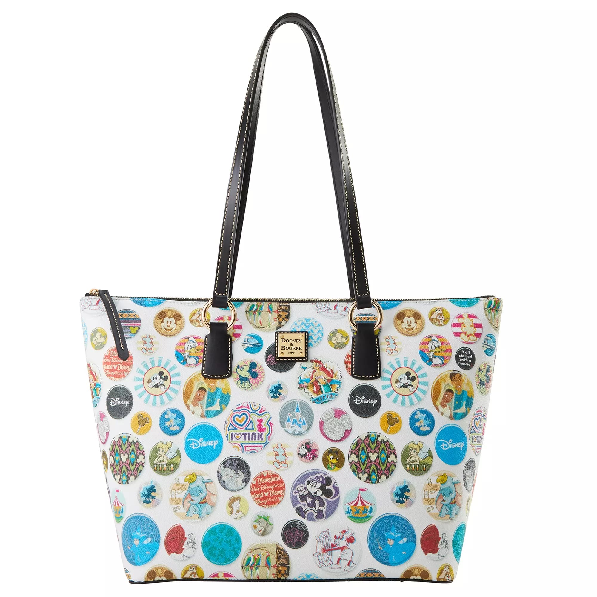White tote bag with black handles, Disney Buttons, and a Dooney & Bourke logo plaque add a playful touch.
