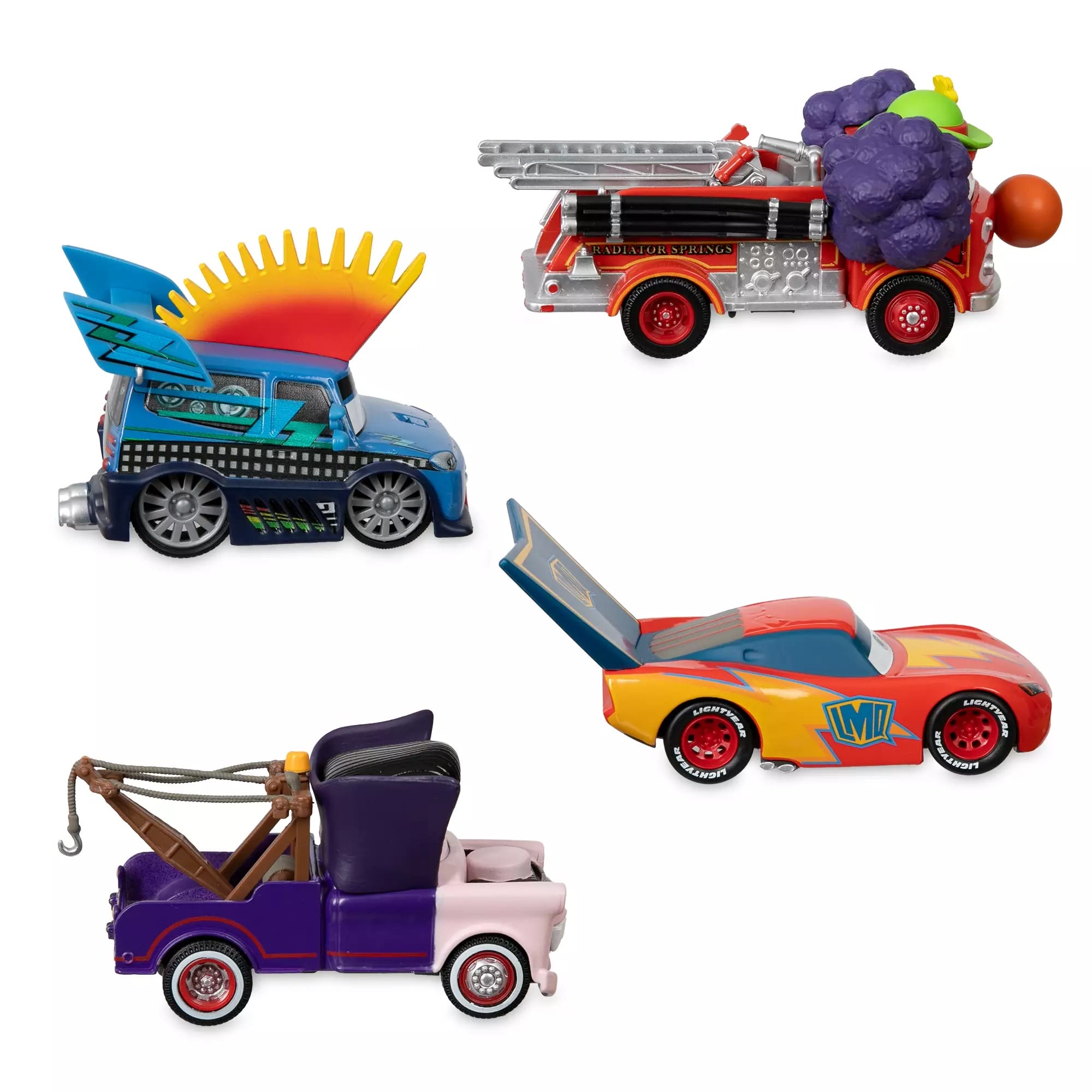 Four colorful Cars Halloween Die Cast Figures with flames, wings, smoke, and a tow truck from the Disney Store.