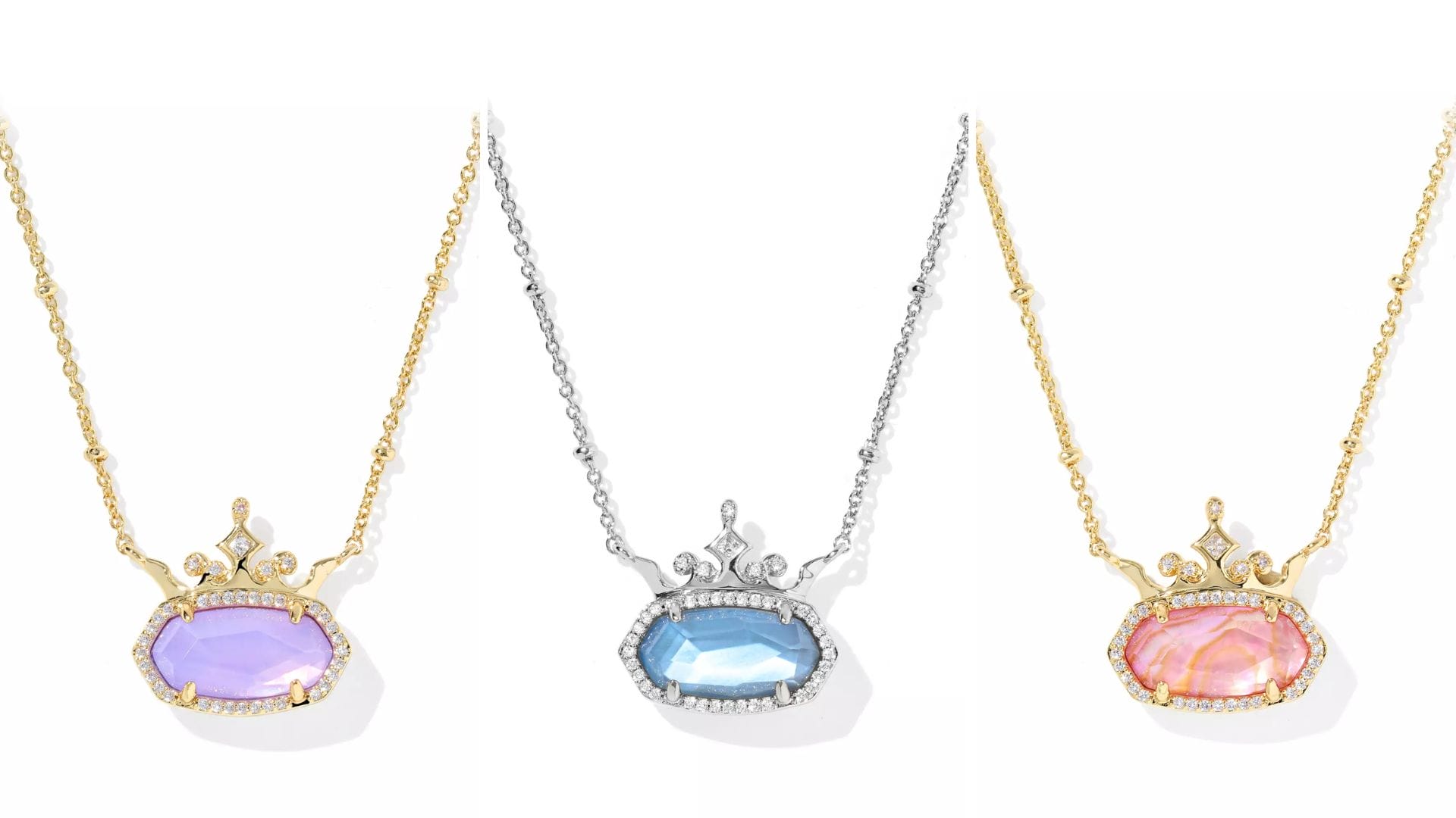 Three Disney Princess Necklaces by Kendra Scott with crown accents and oval gemstones, available in gold and silver.