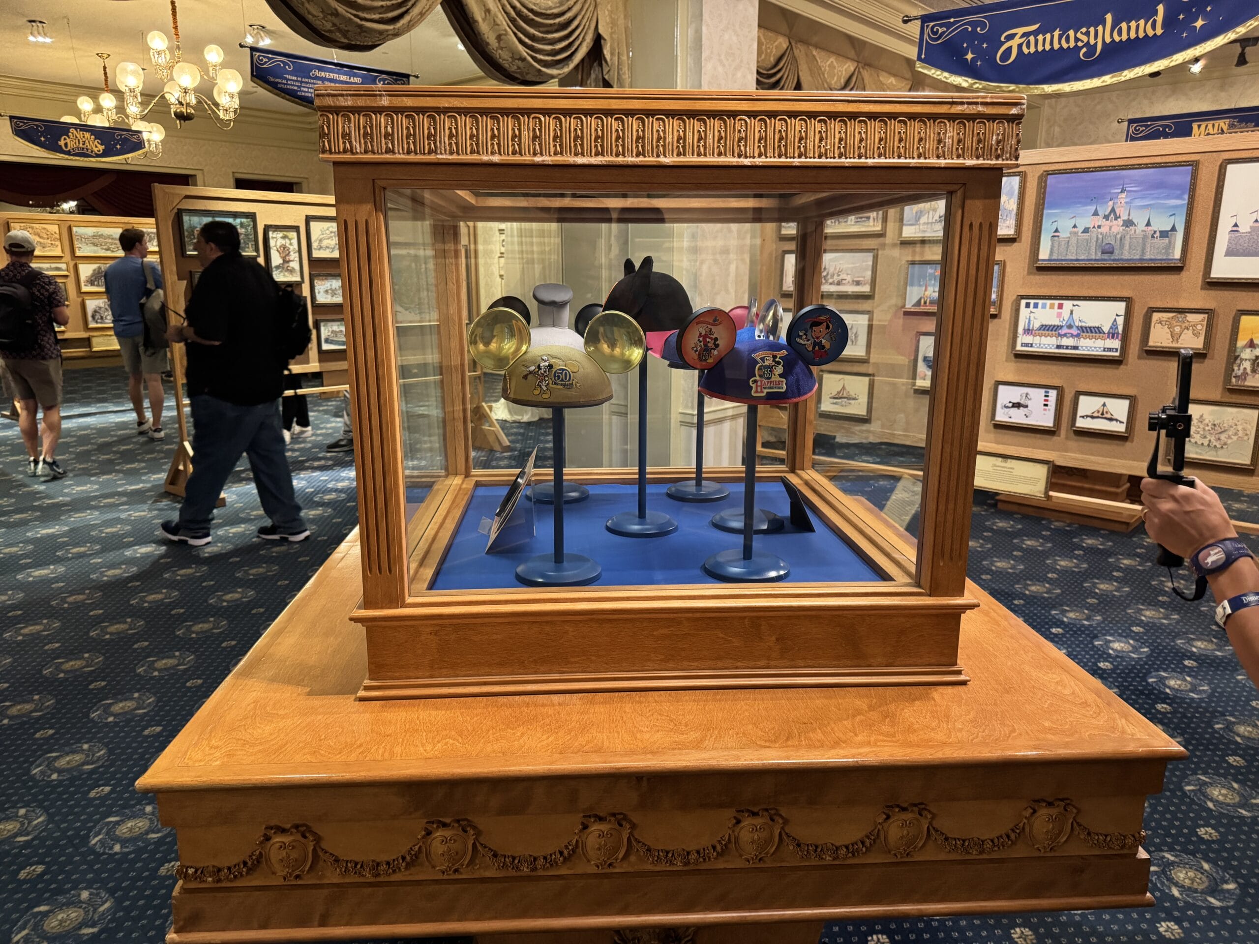 A display case with decorated Mickey Mouse ear hats is featured among new exhibits at the Main Street Opera House.