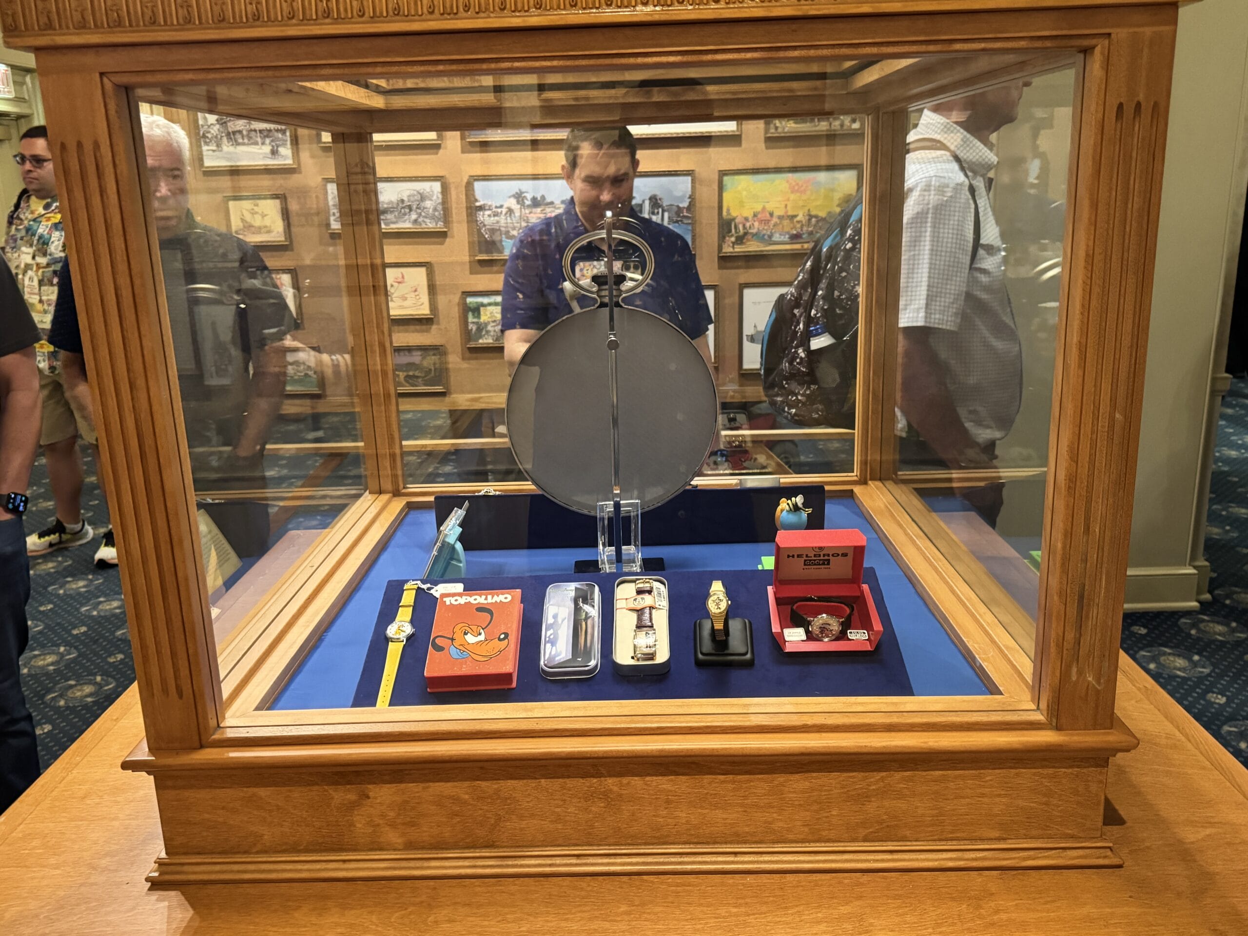 A glass display case with vintage Disney memorabilia draws crowds at the Main Street Opera House’s new exhibits.