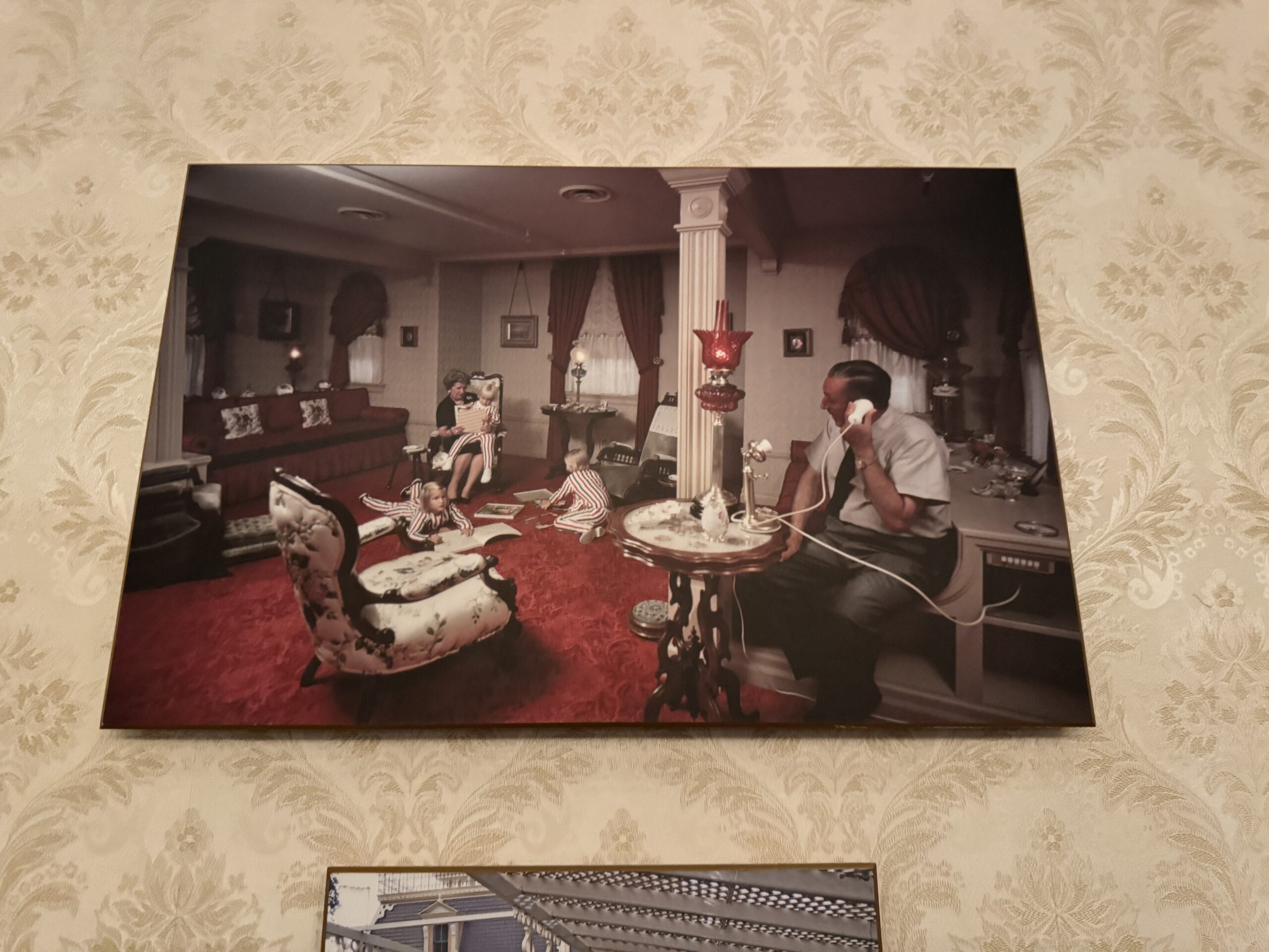 A vintage living room scene with a man on the phone and a woman on a sofa, like photos from Main Street Opera House.
