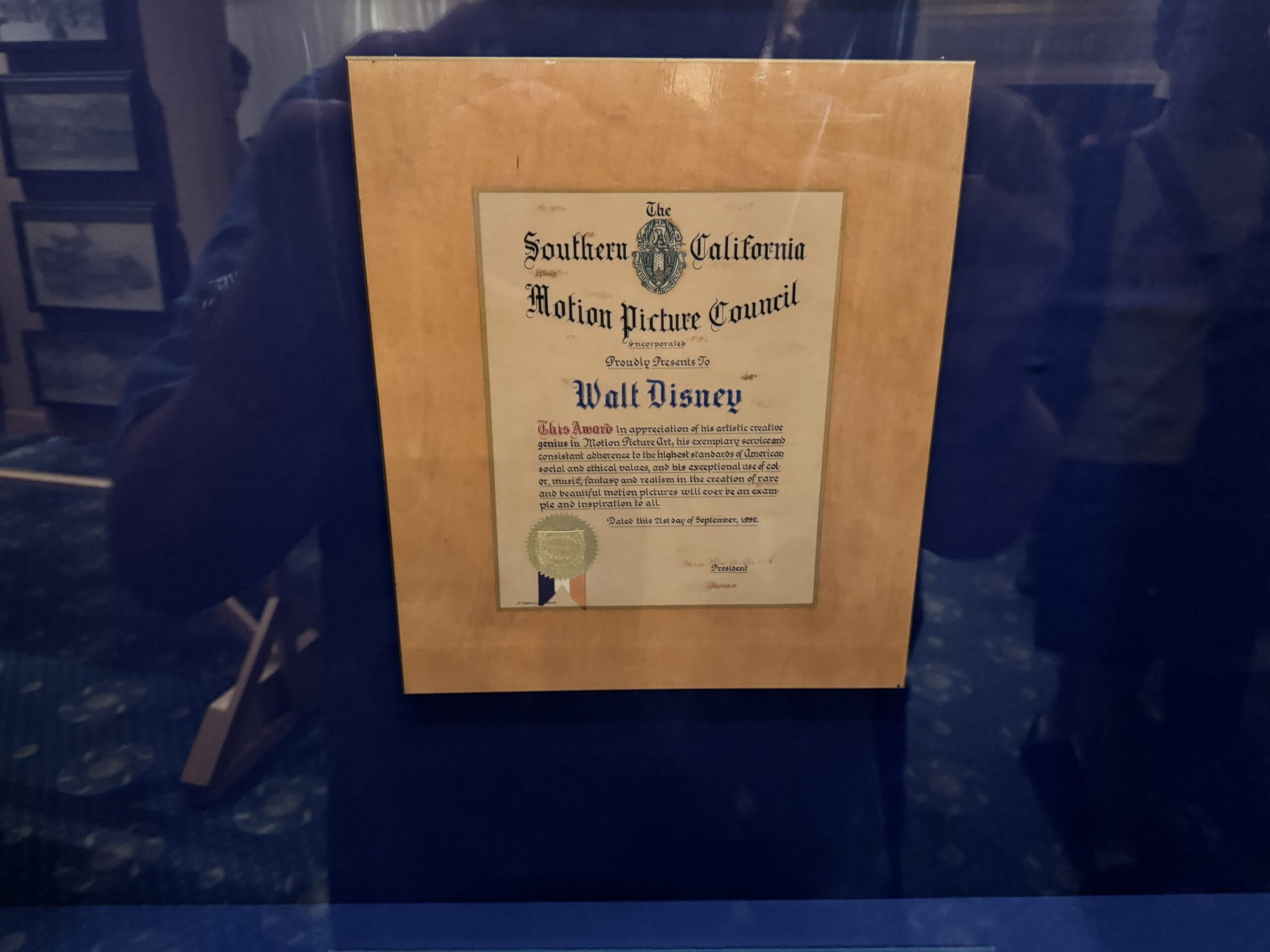 A framed certificate awarded to Walt Disney is displayed on the Main Street Opera House among new exhibits.