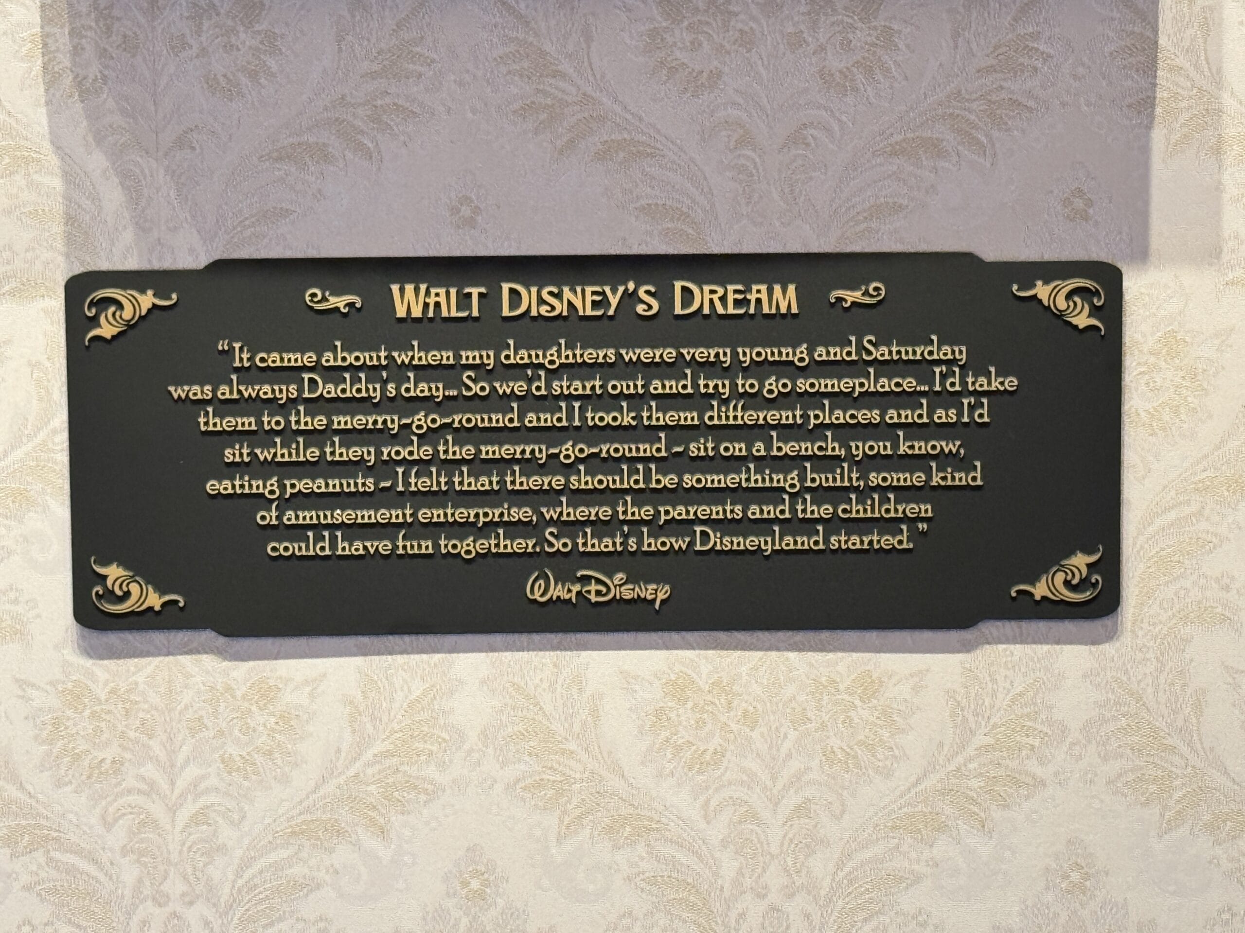 A plaque at the Main Street Opera House reveals how Disneyland history began with Walt spending time with his daughters.