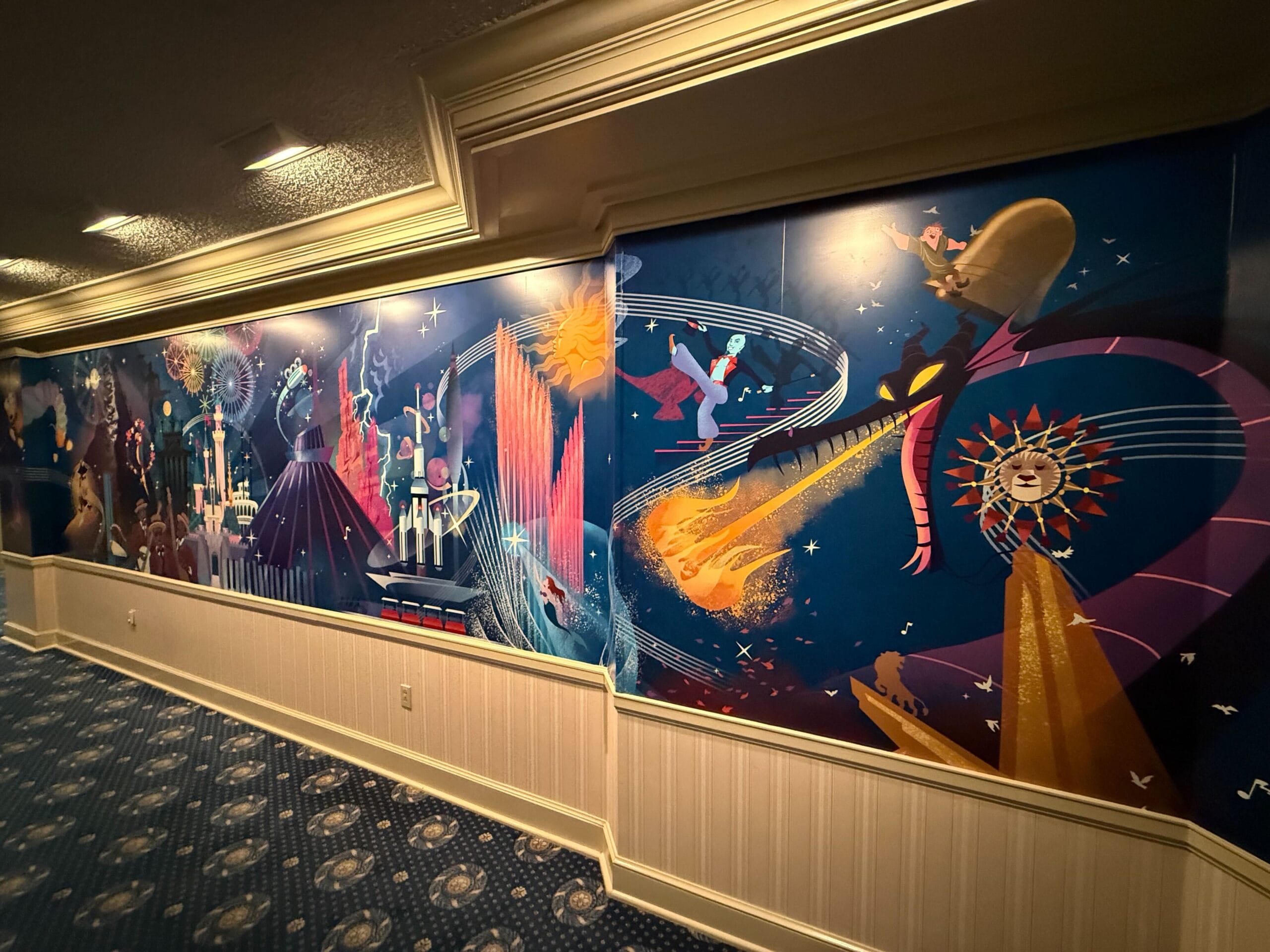 Colorful mural of Fantasia scenes with Mickey Mouse at the main street opera house, featuring magical, cosmic imagery.