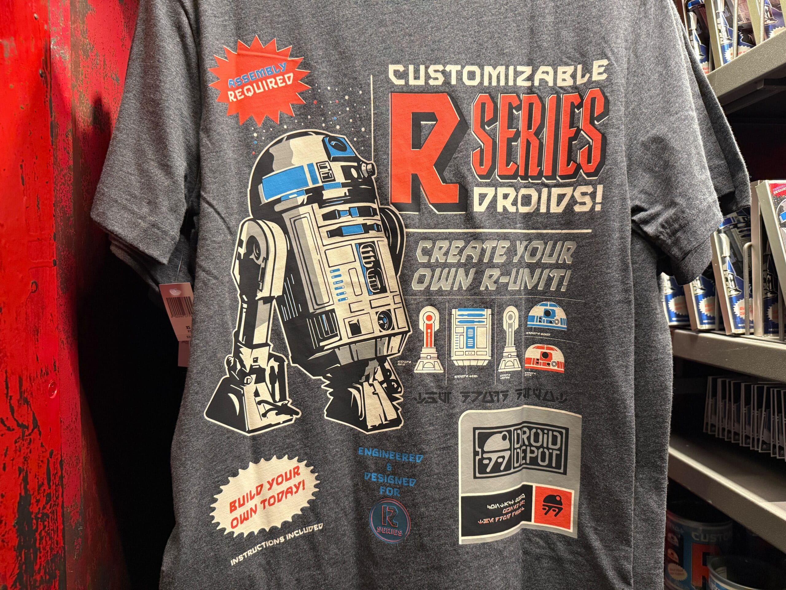 Gray t-shirt featuring customizable R-series droids design, with R2-D2 and various droid parts and graphics.