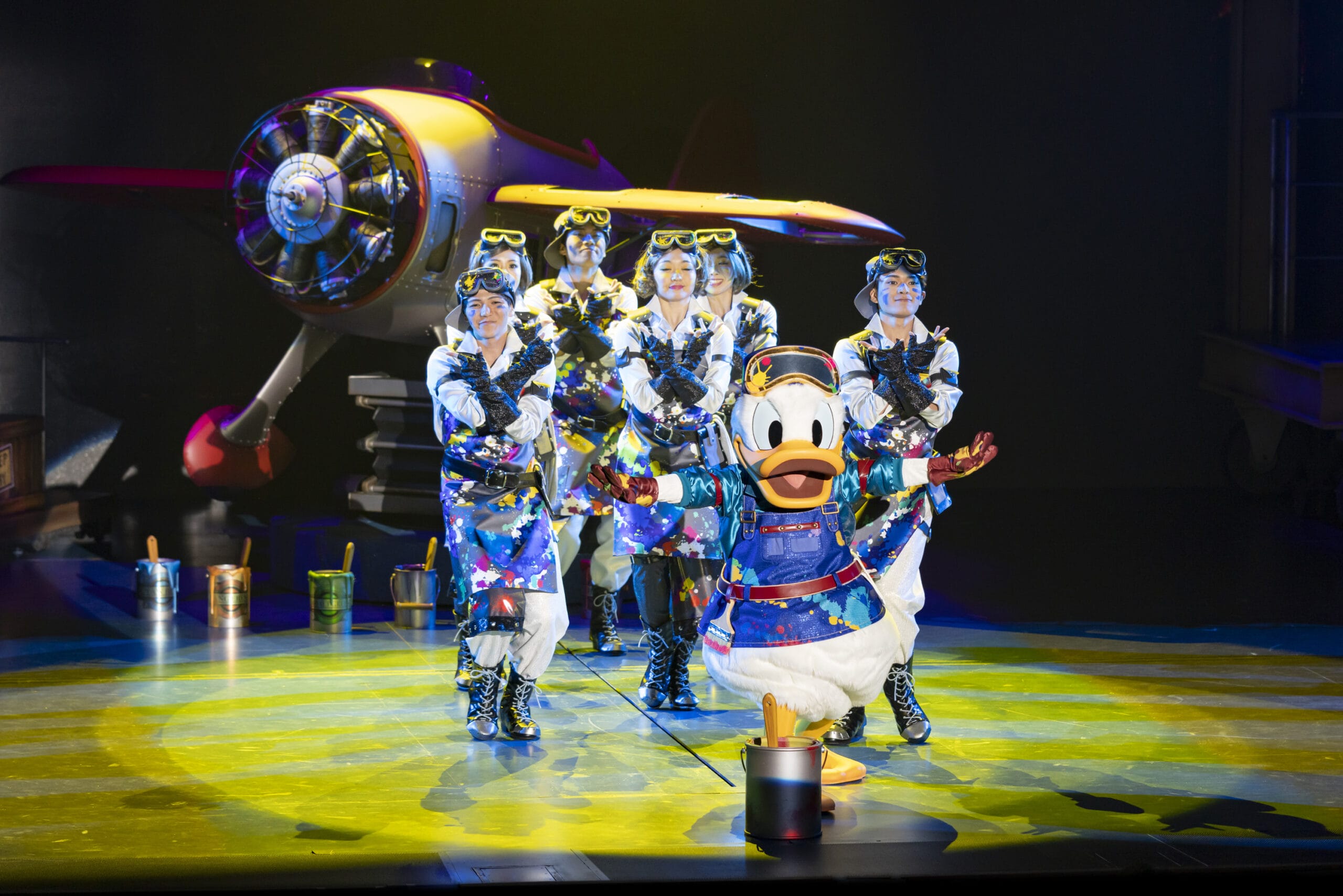 Donald Duck and dancers in shiny costumes perform as dreams take flight on stage at Tokyo DisneySea.