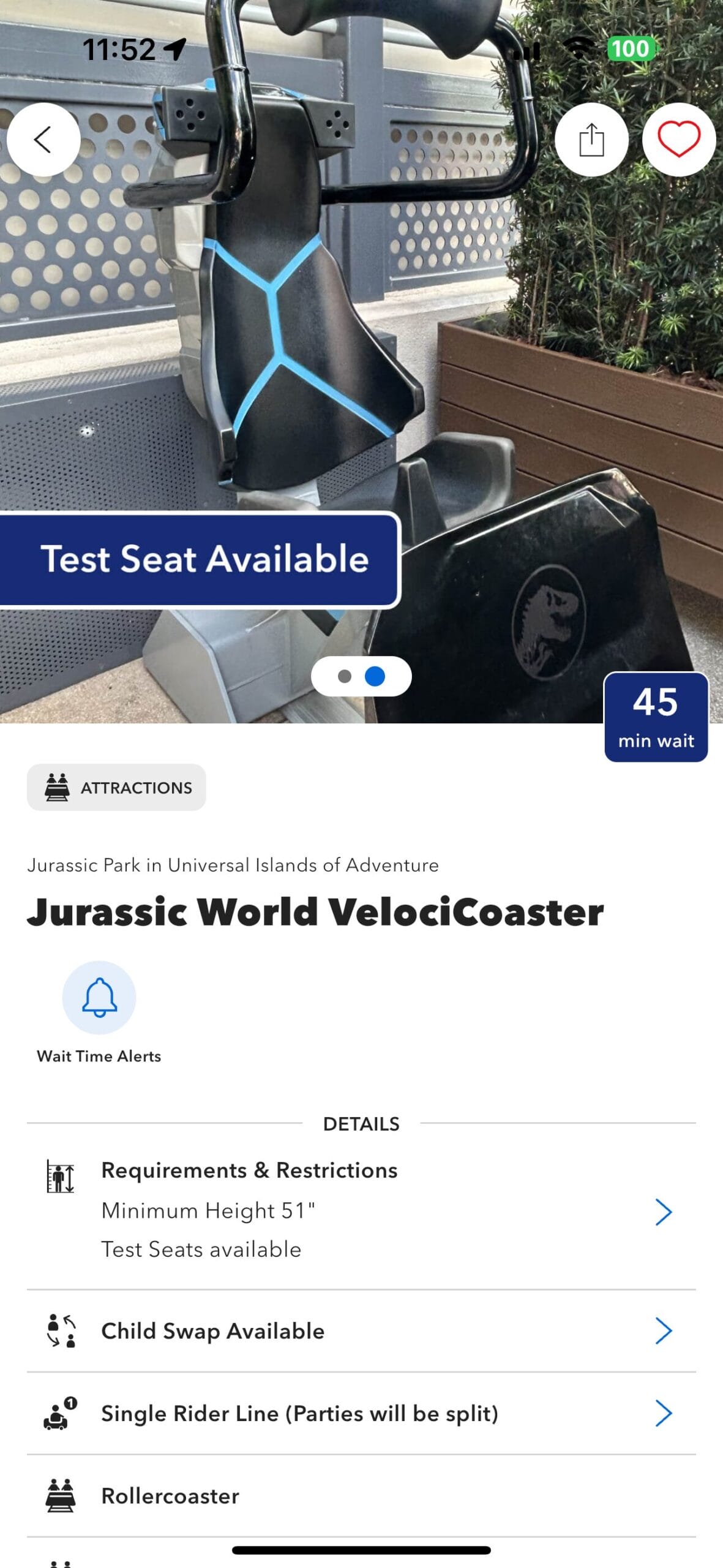 VelociCoaster test seat at Universal’s Jurassic Park, with a "Test Seat Available" sign and 45-minute wait time displayed.