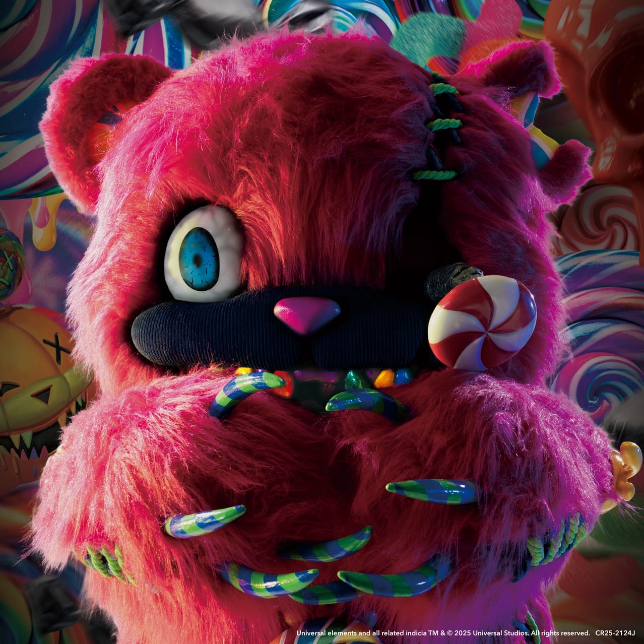 A bright pink, fuzzy bear with large claws holds a HamiKuma Candy lollipop amid sweets at Halloween Horror Nights.