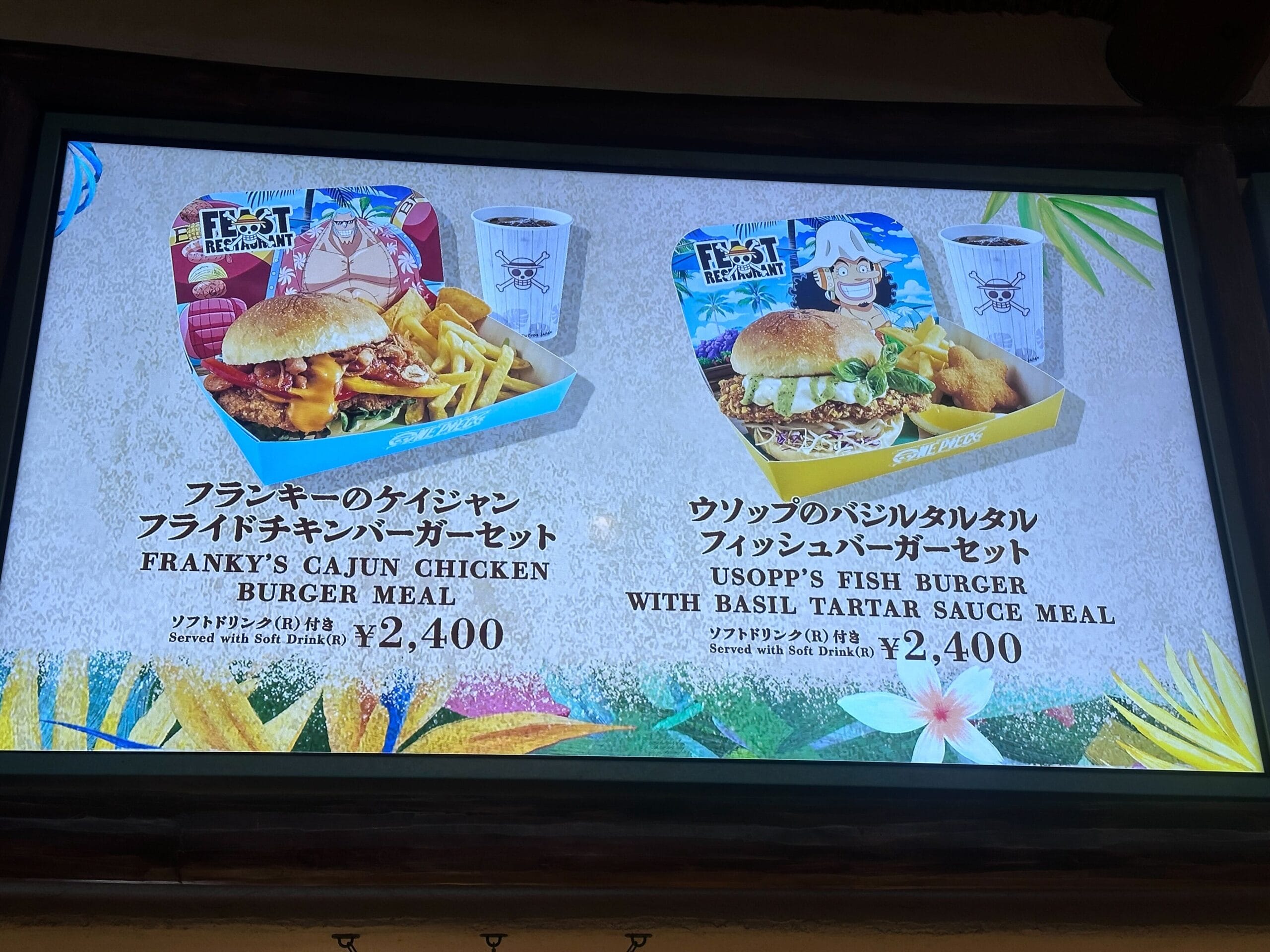 Menu board showing Franky's Cajun Chicken Burger Meal and Usopp's Fish Burger Meal, each priced at 2,400 yen.