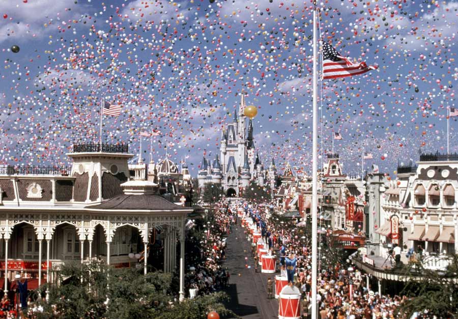 Thousands of balloons fill the sky above Main Street at a Walt Disney World celebration near Cinderella Castle.