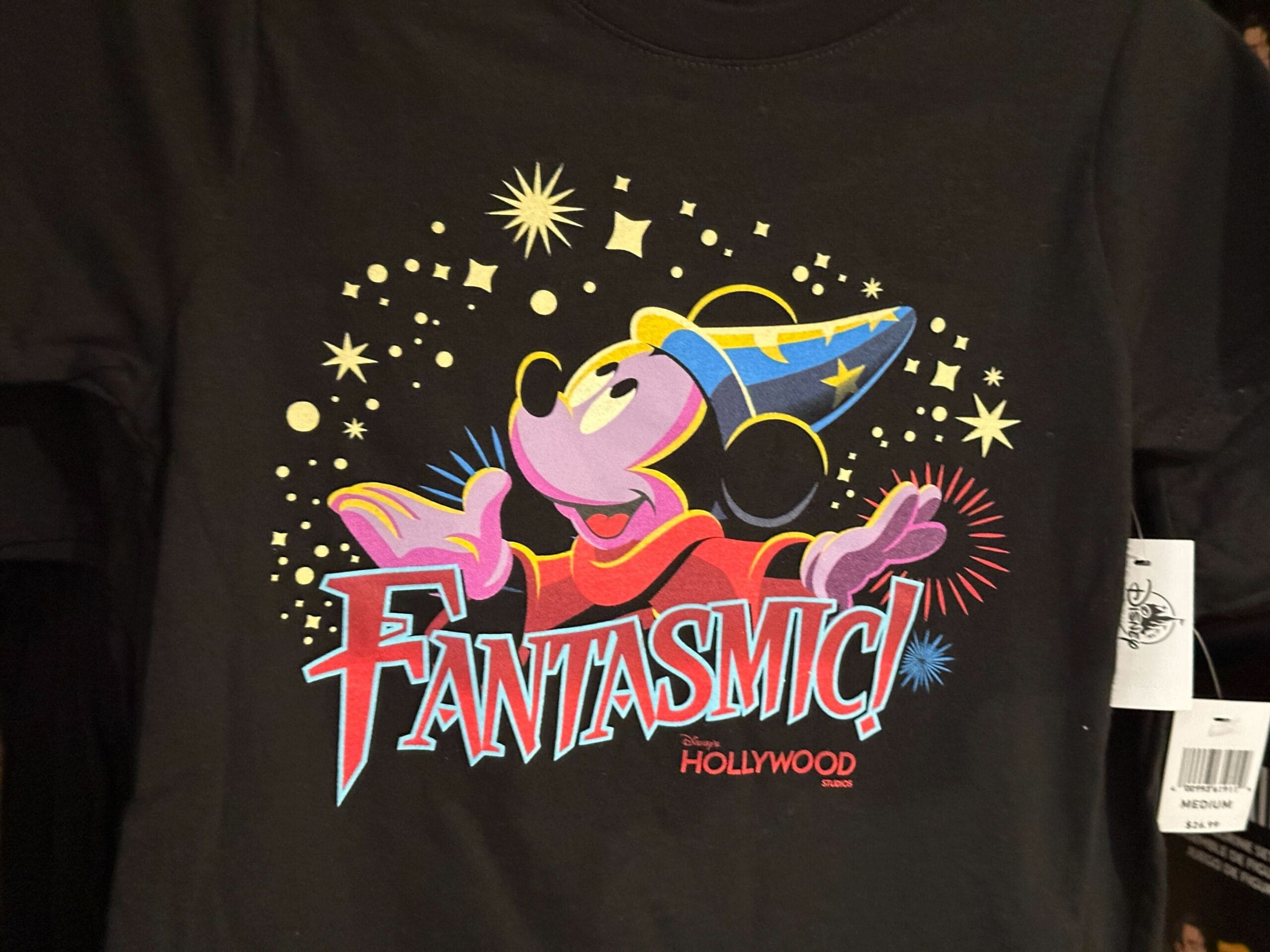 Mickey Mouse as a sorcerer with stars and "Fantasmic!" from Disney's Hollywood Studios on a black t-shirt.