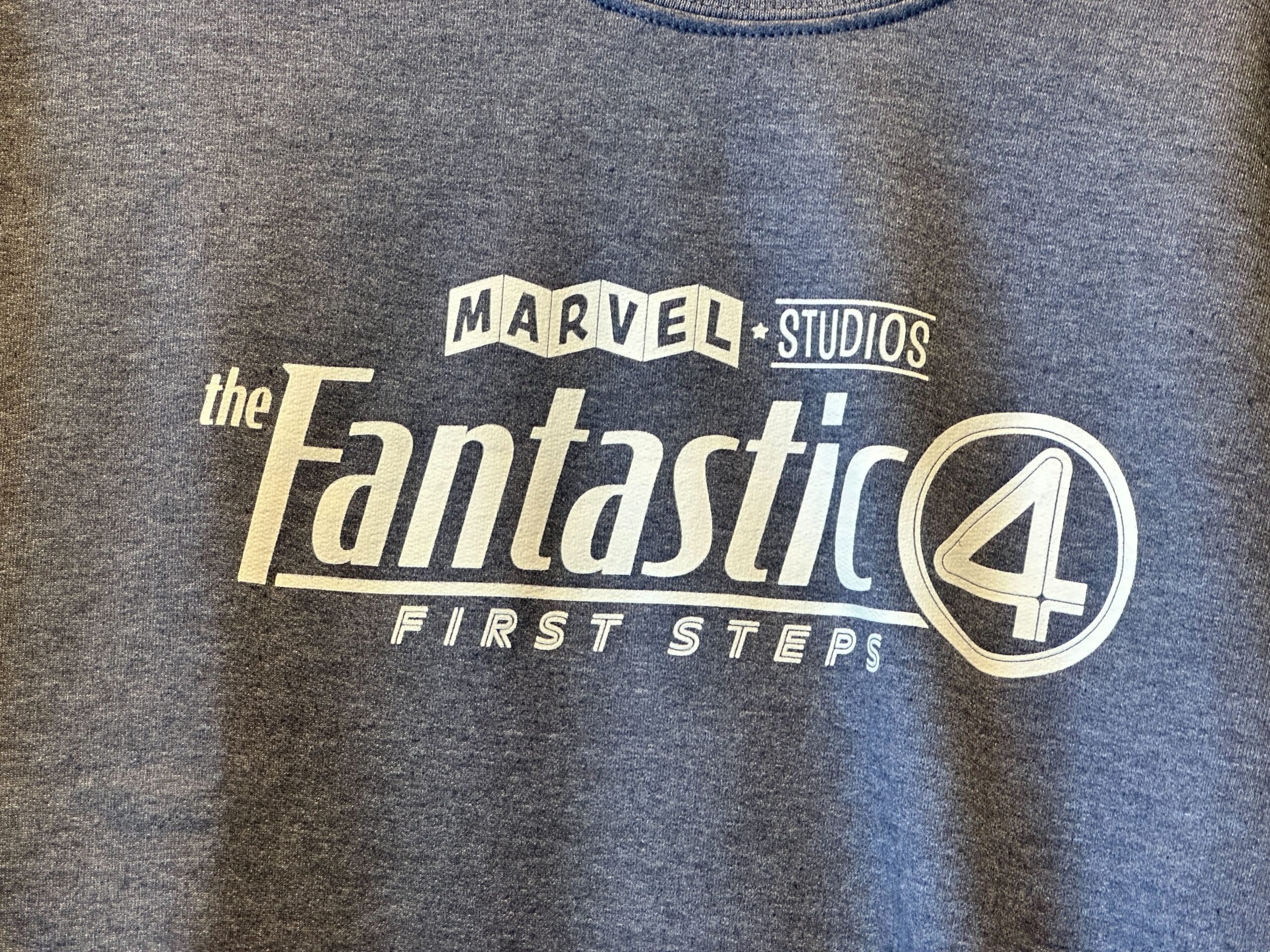 Blue shirt with "Marvel Studios The Fantastic 4 First Steps"—a must-have Youth Avengers Apparel for fans.