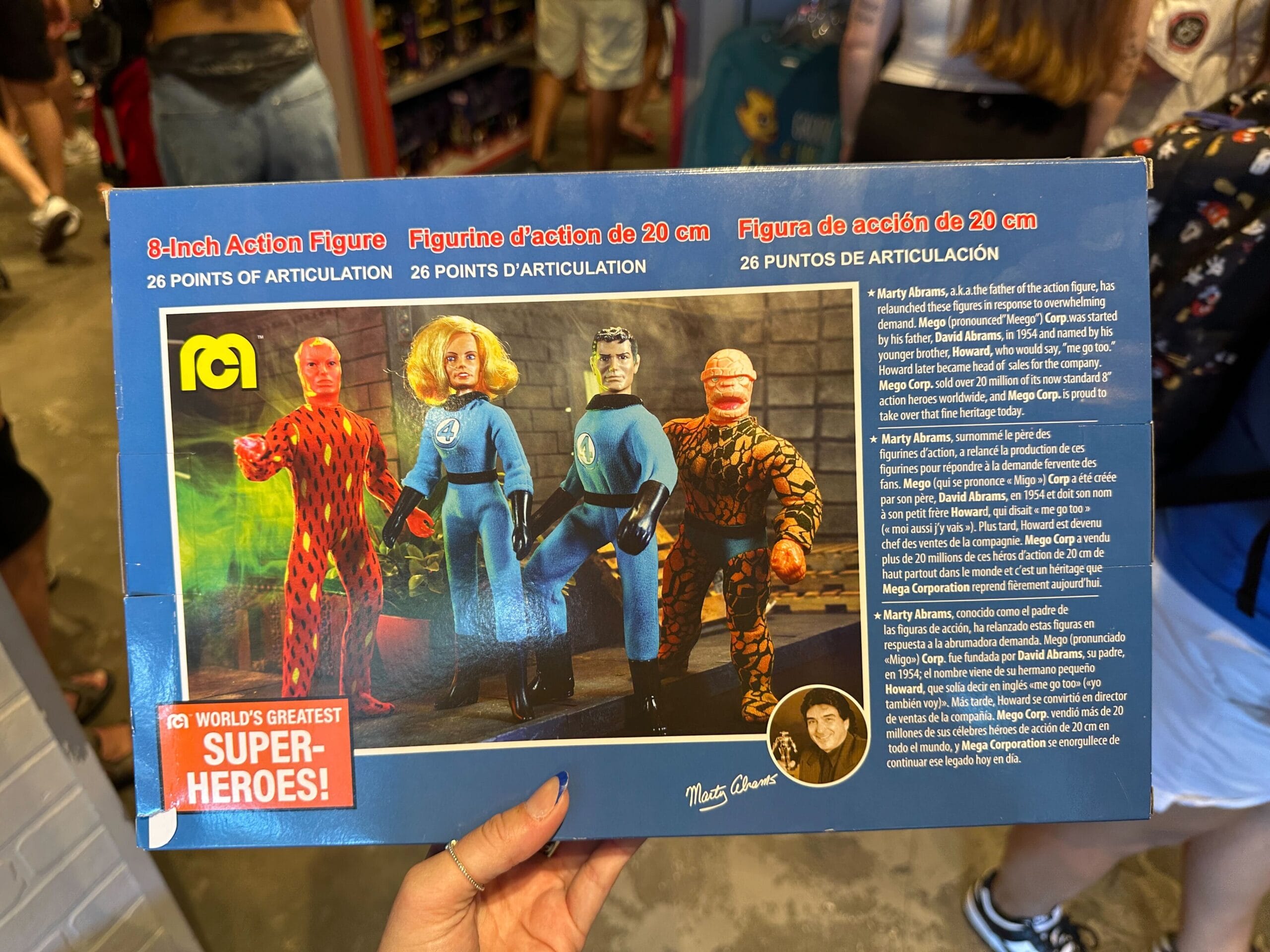A person holds a Fantastic Four action figure box, part of the latest Marvel merchandise collection.