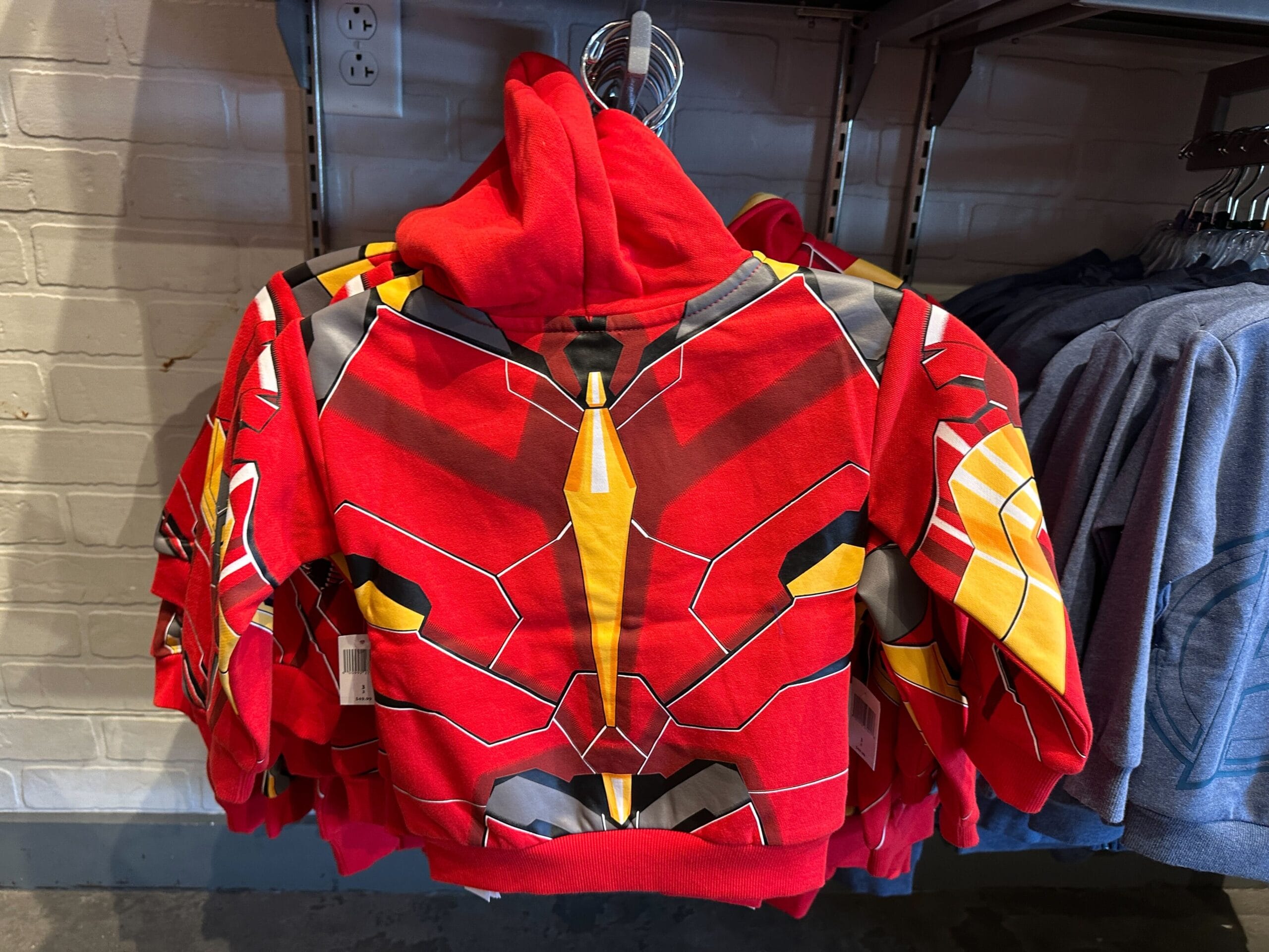 Red hoodie with a bold, geometric superhero mask design, perfect for Youth Avengers Apparel at Walt Disney World.