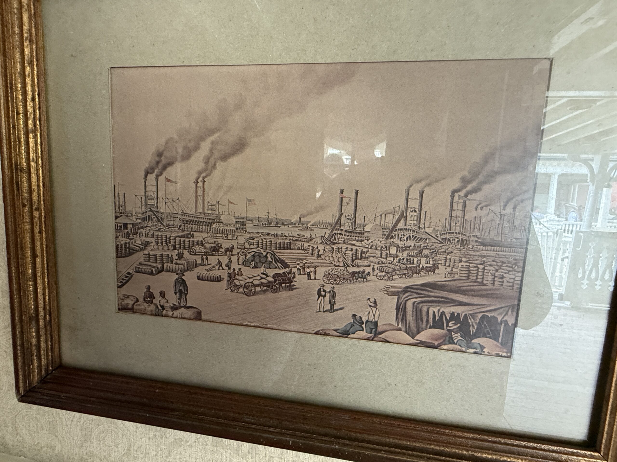 Framed drawing of a busy 19th-century port, evoking the Liberty Square Riverboat at Magic Kingdom.