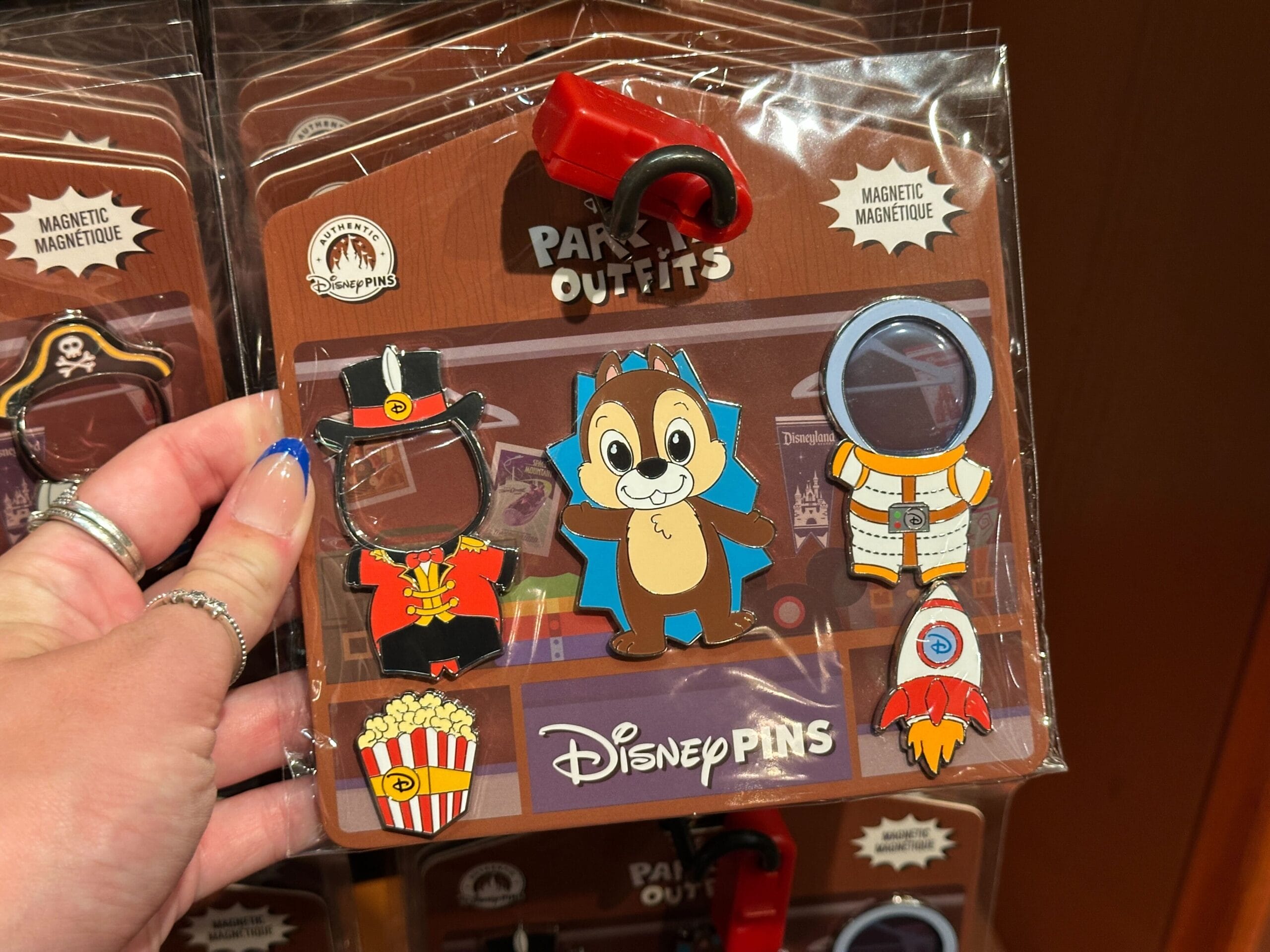 Disney pin set with Chip wearing a cape, and two magnetic outfits: a popcorn vendor and an astronaut suit.