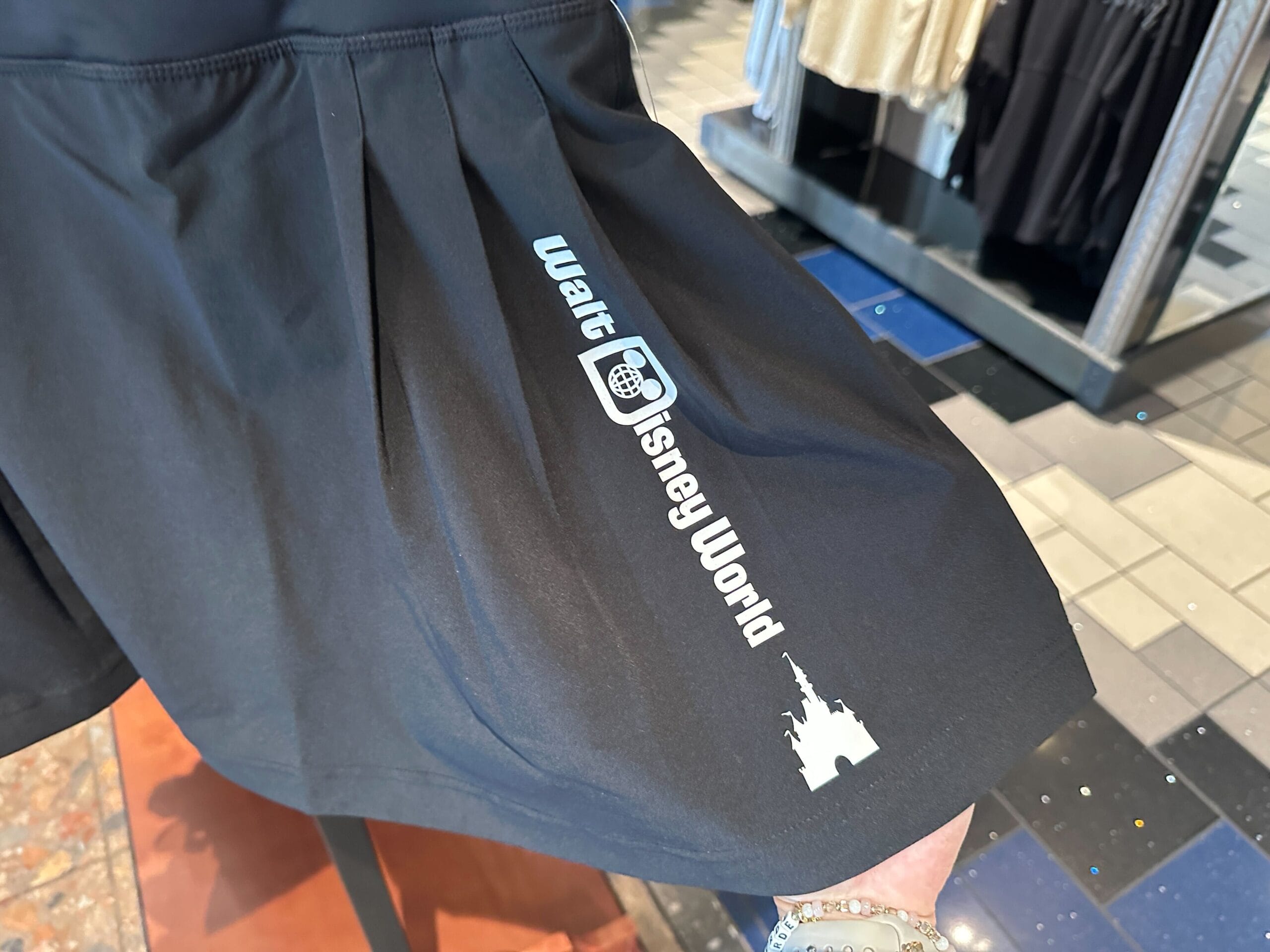Black skirt with “Walt Disney World” and a castle graphic—perfect for fans of new Disney products.