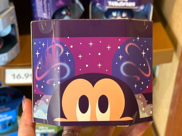 Colorful box shows cartoon eyes peeking up, with a WDW castle and sparkly night sky in the background.