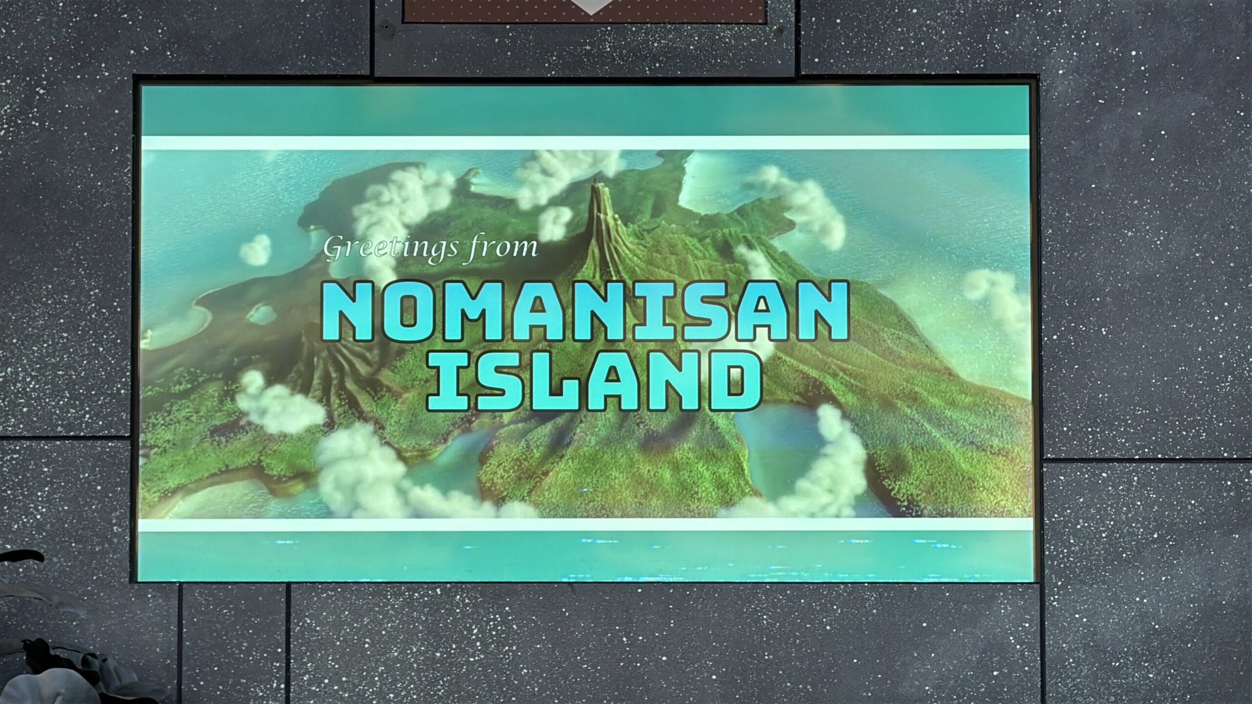 A postcard reads "Greetings from Nomanisan Island" over an aerial view of a lush, green Disney island.
