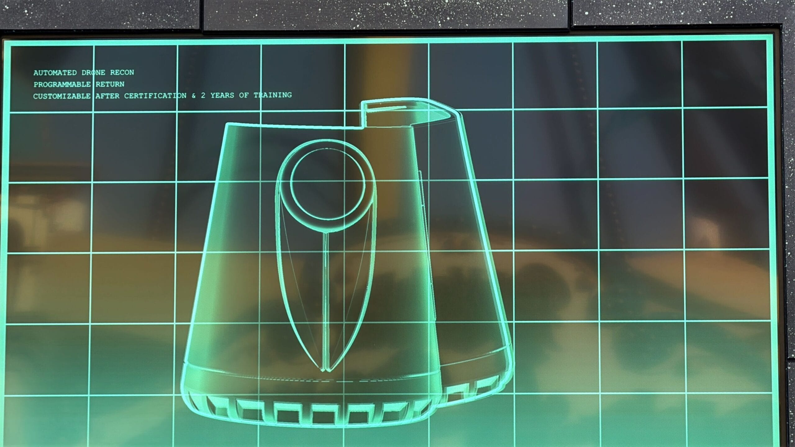 A digital screen displays Treat Trail Locations for Oogie Boogie Bash with a blueprint and green grid background.
