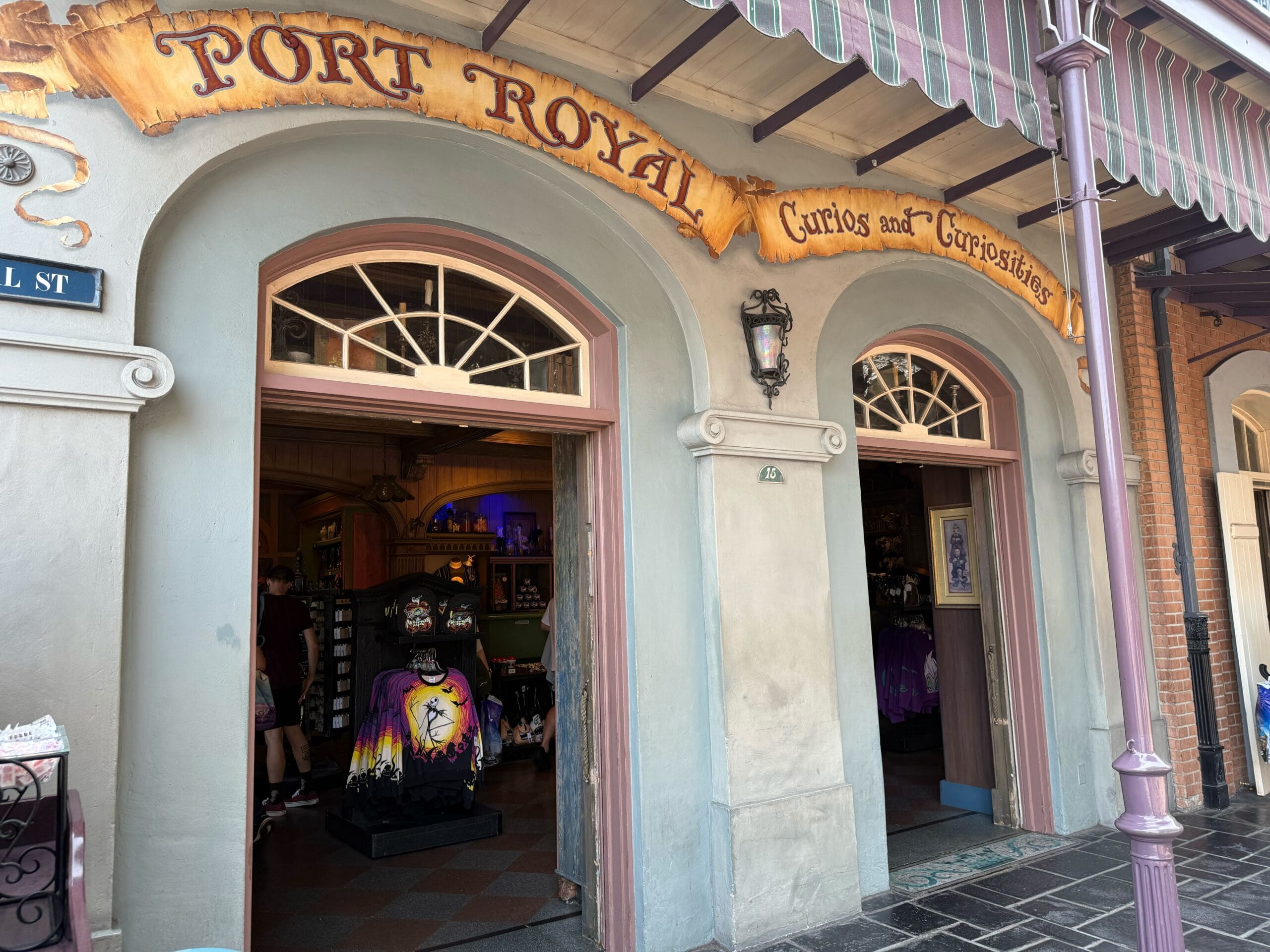 Front view of Port Royal Curios and Curiosities shop with open doors and merchandise visible inside.