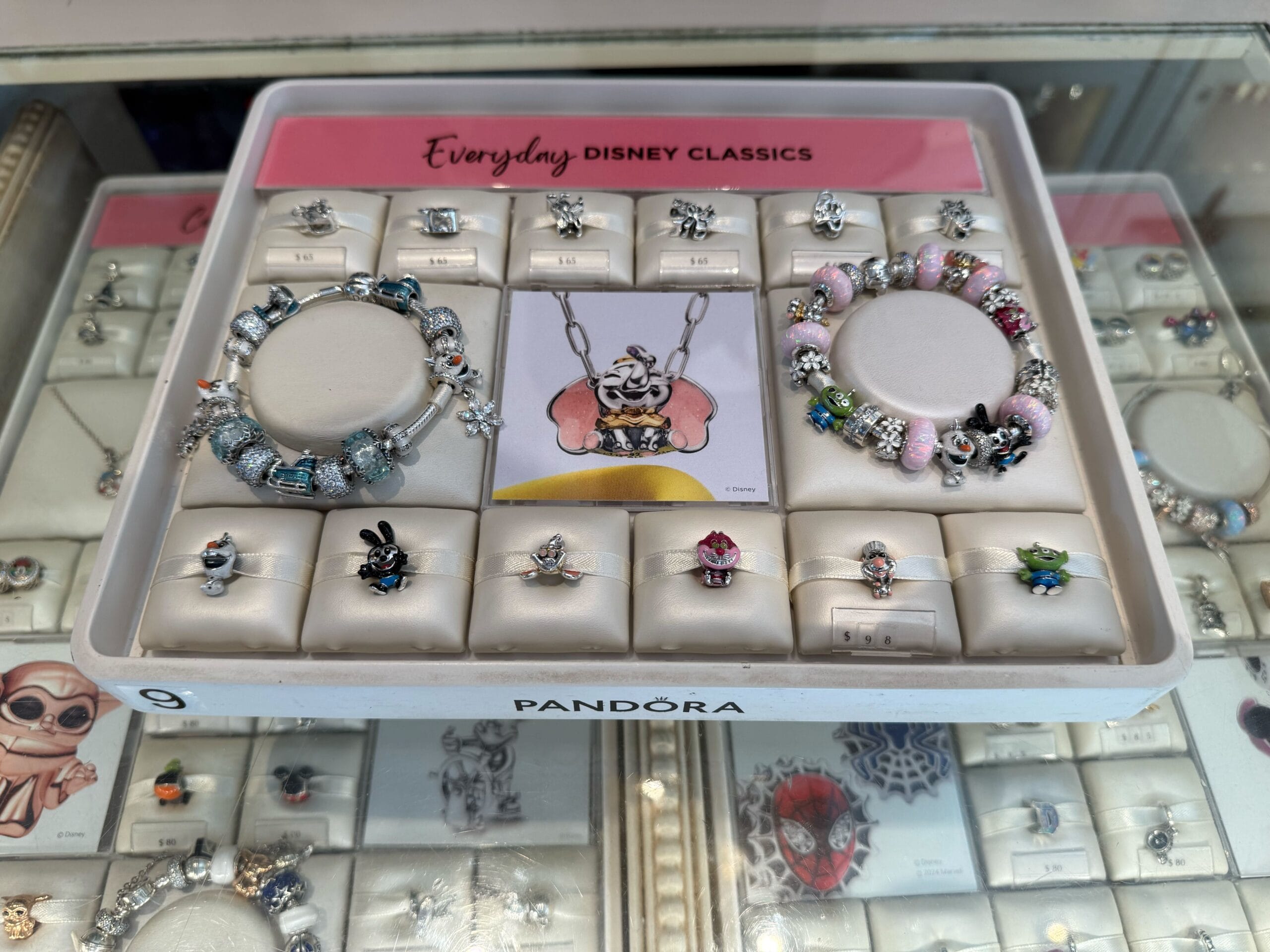 New Disneyland Resort Pandora Charms and rings showcased in a jewelry case labeled "Everyday Disney Classics.