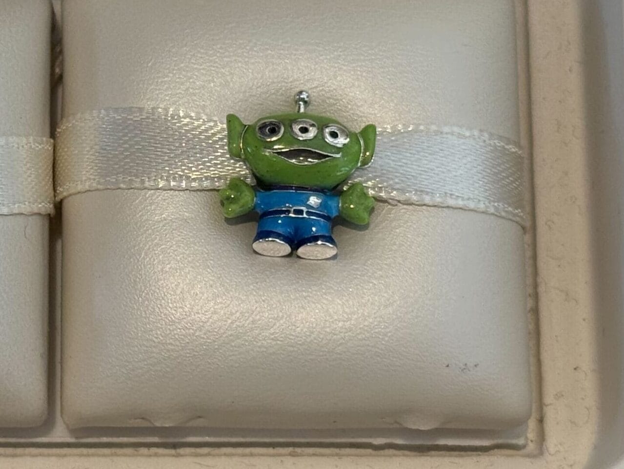 Two new Pandora Charms at Disneyland Resort: Remy from Ratatouille and a Toy Story alien. Price tag shows $98.