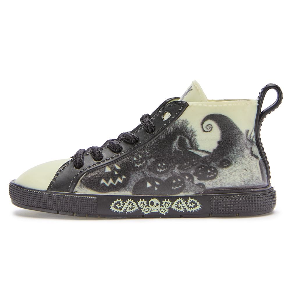 High-top sneaker featuring black Halloween-themed designs with pumpkins, skulls, and a spooky landscape on a pale background.