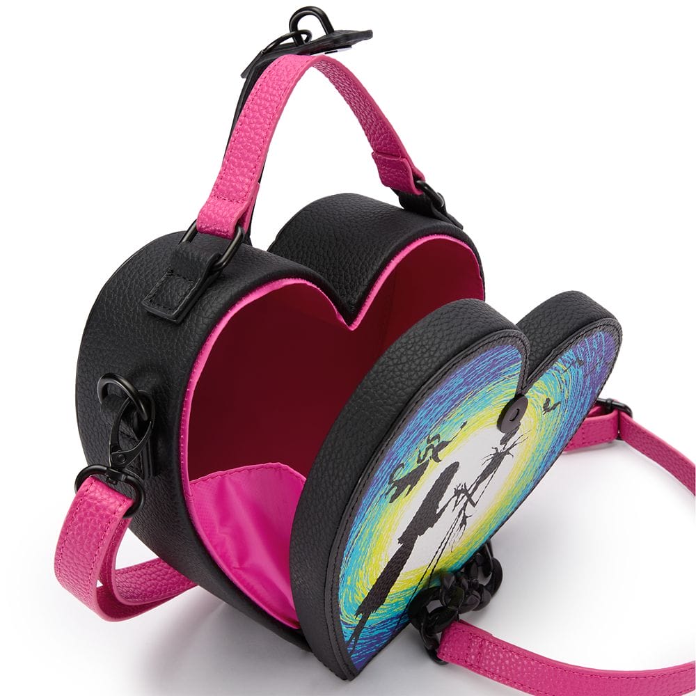 Heart-shaped black and pink purse with a colorful Nightmare Before Christmas design and open red interior.
